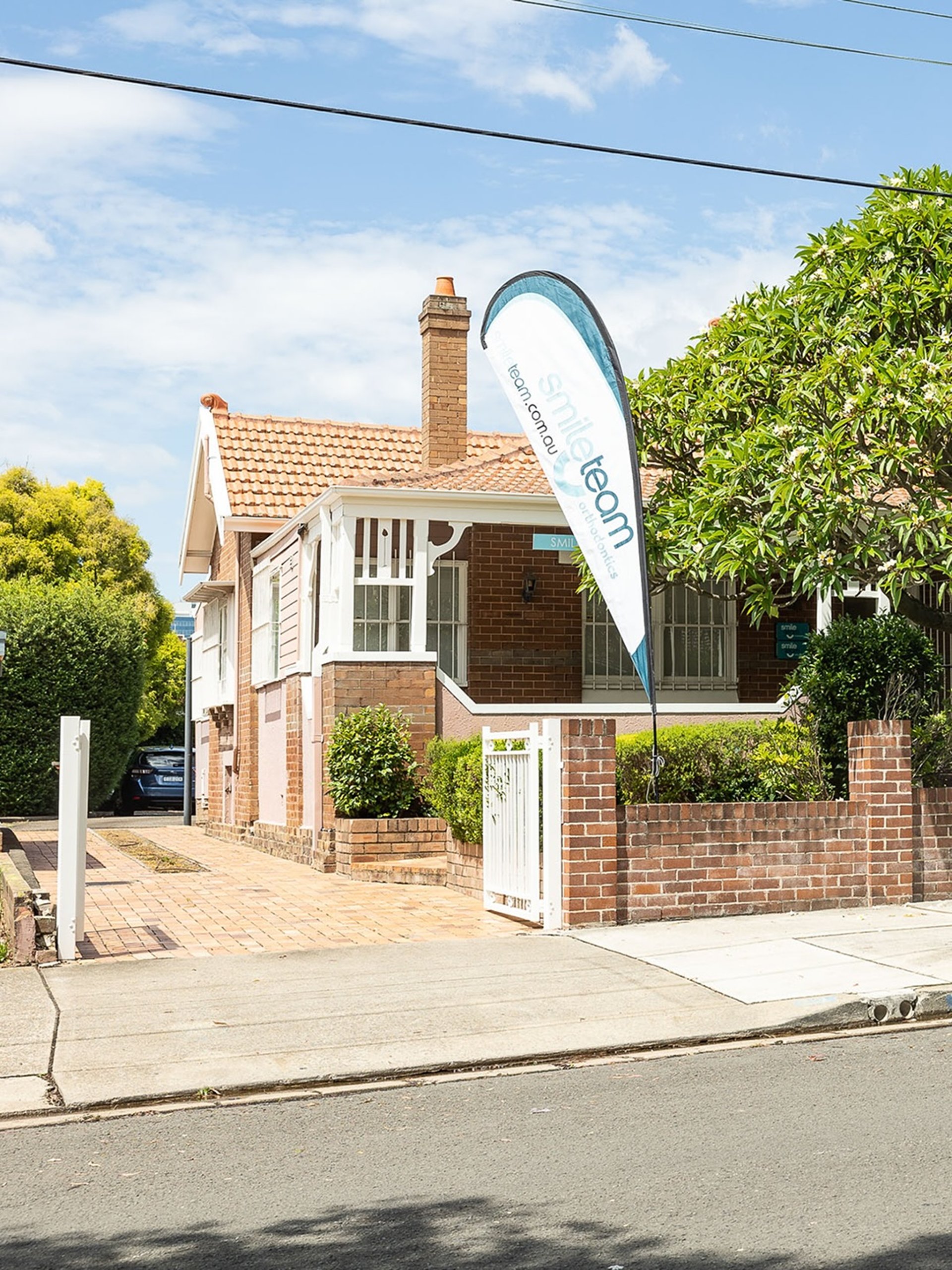 an abstract photo of a curved building with a blue sky in the background