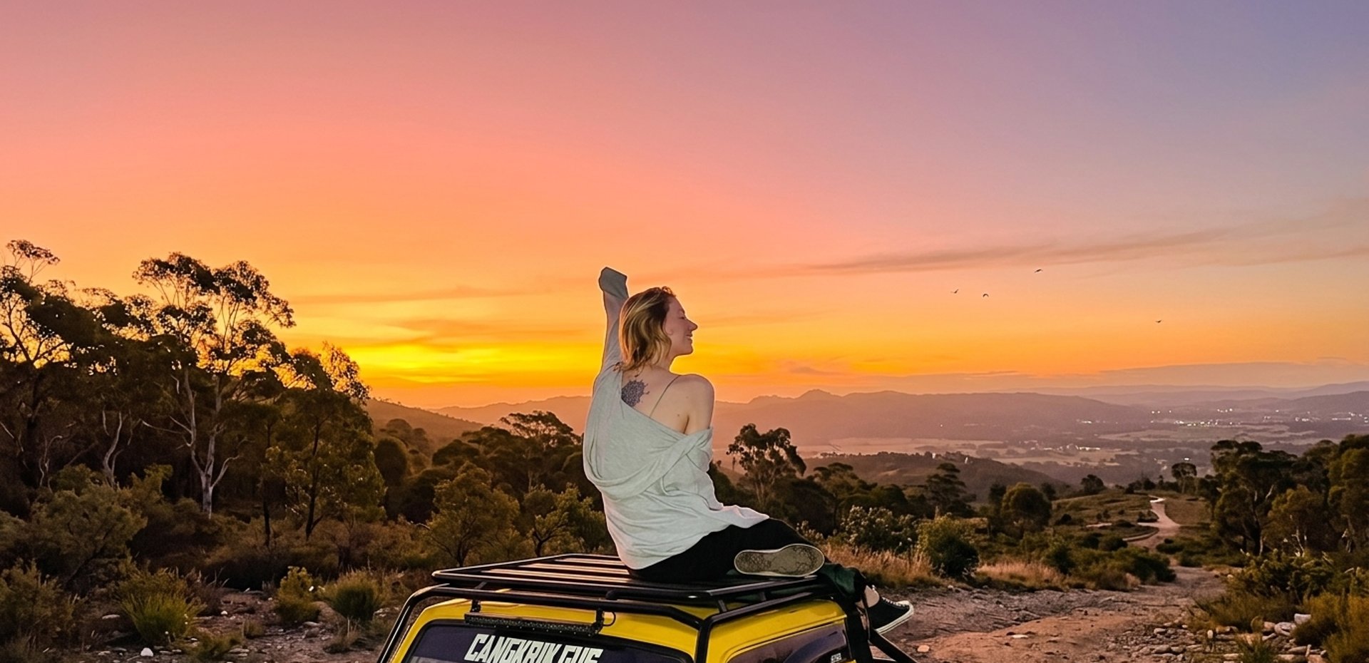 Off-road vehicle against a beautiful sunset.