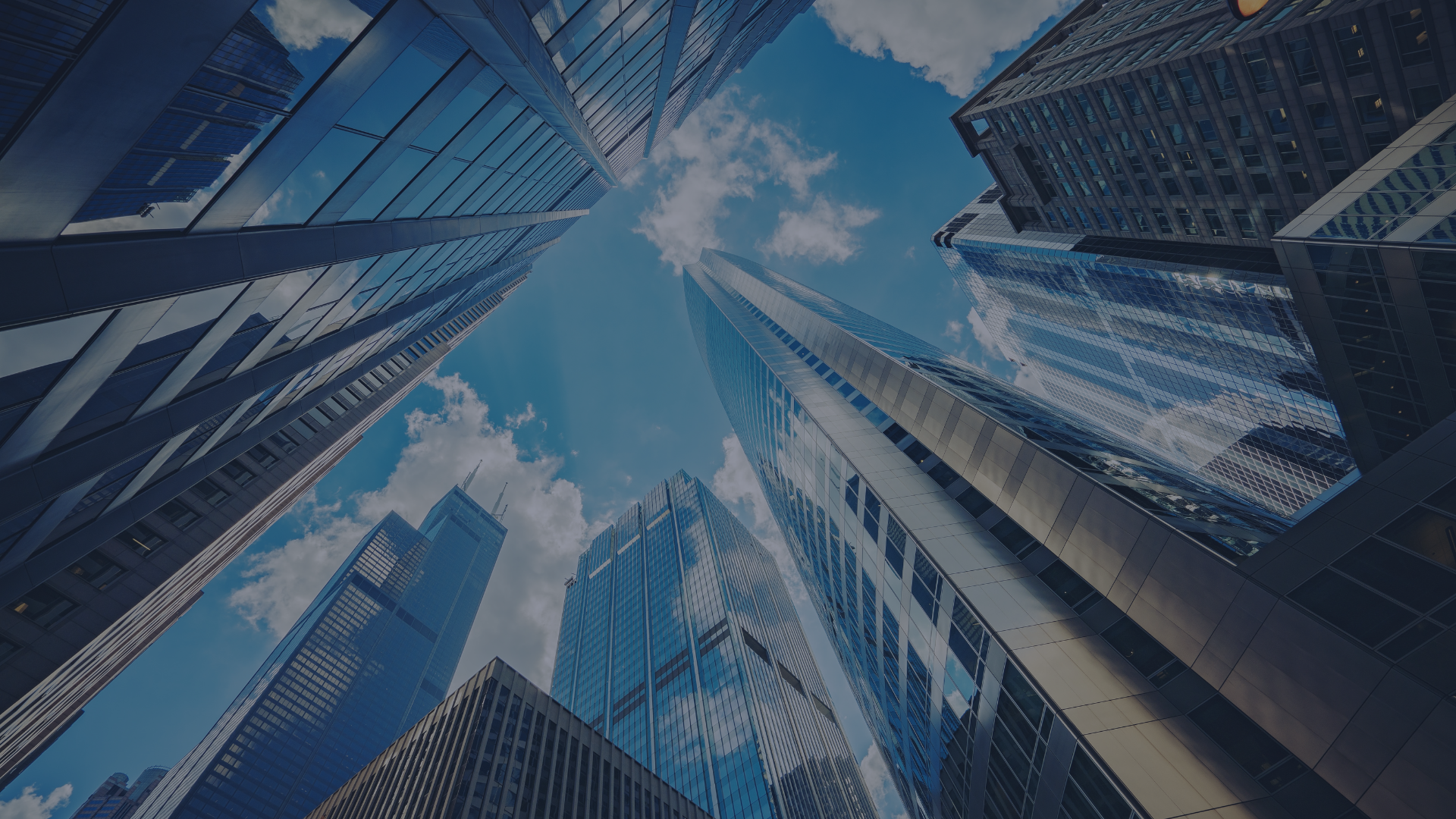 low angle photo of city high rise buildings during daytime