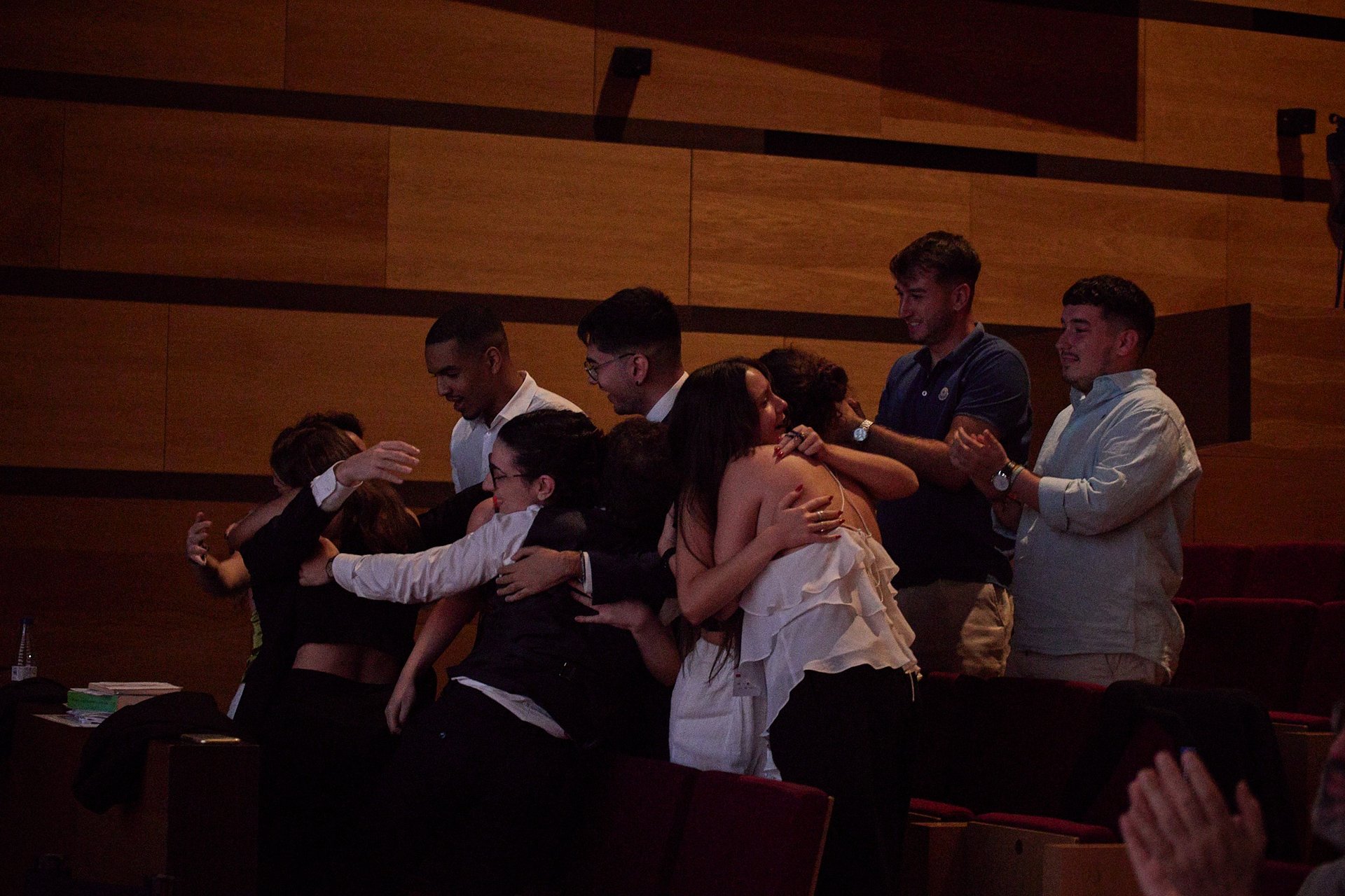 people sitting near table with laptop computer