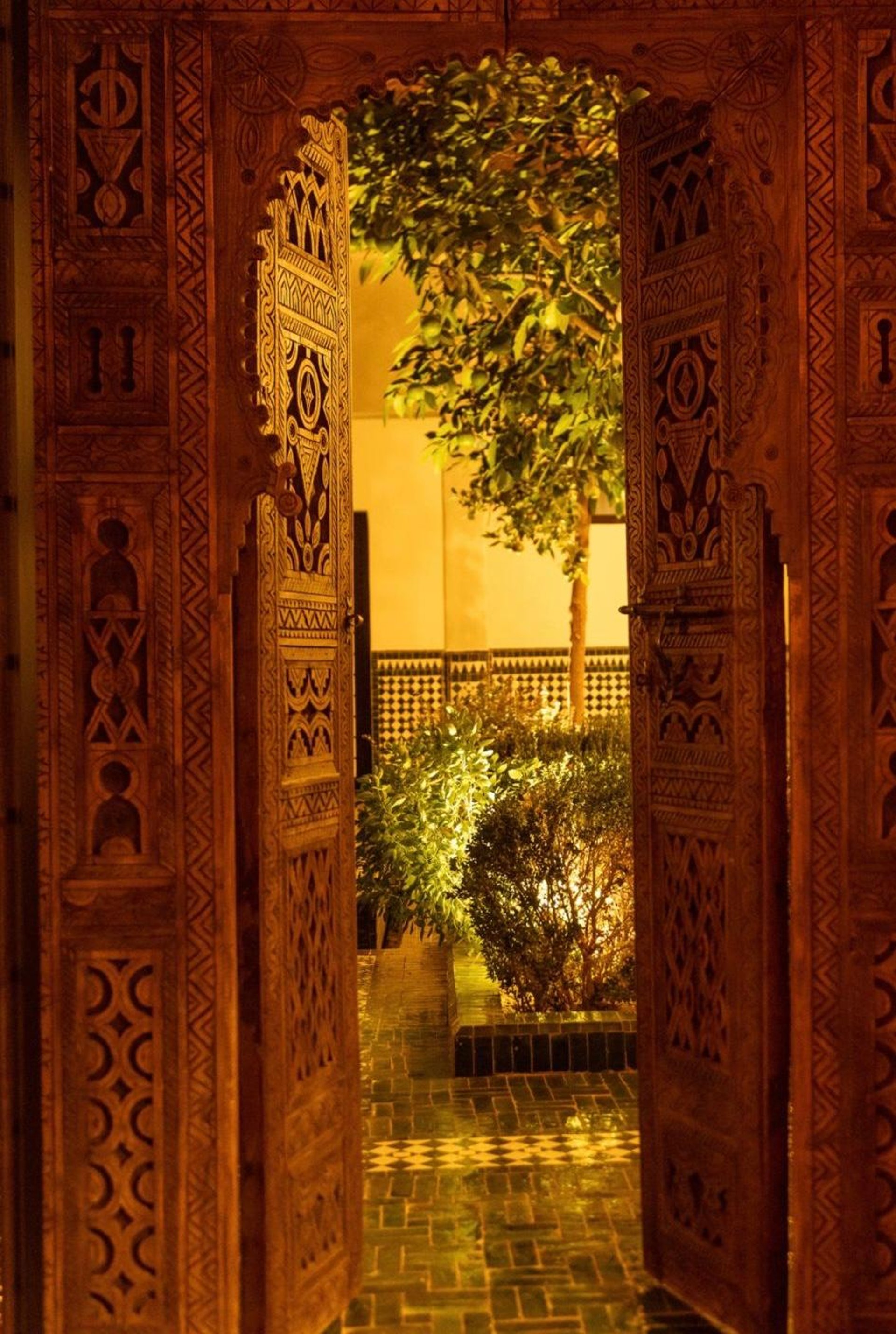 Woman crouching on rocks taking a photo