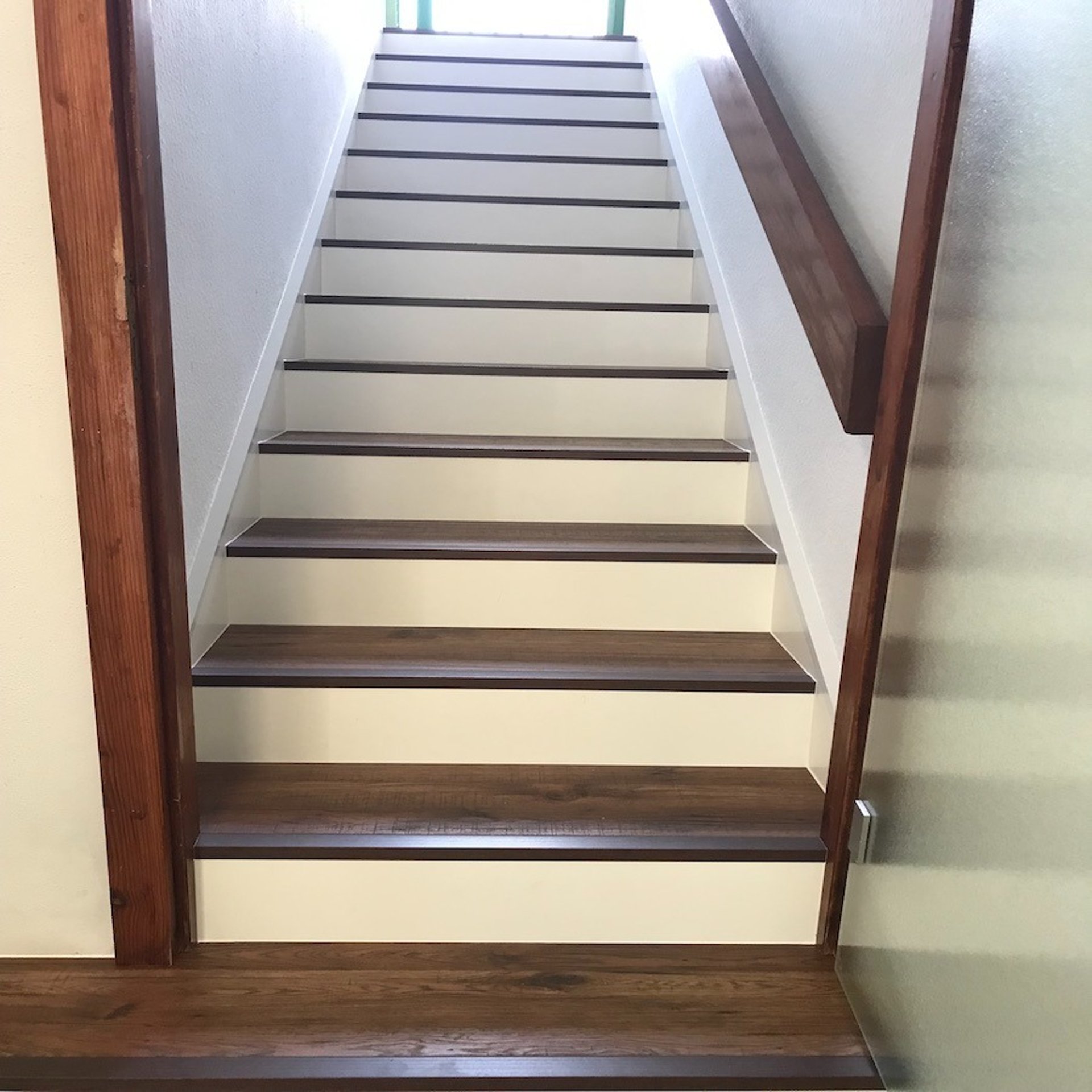 an abstract photo of a curved building with a blue sky in the background