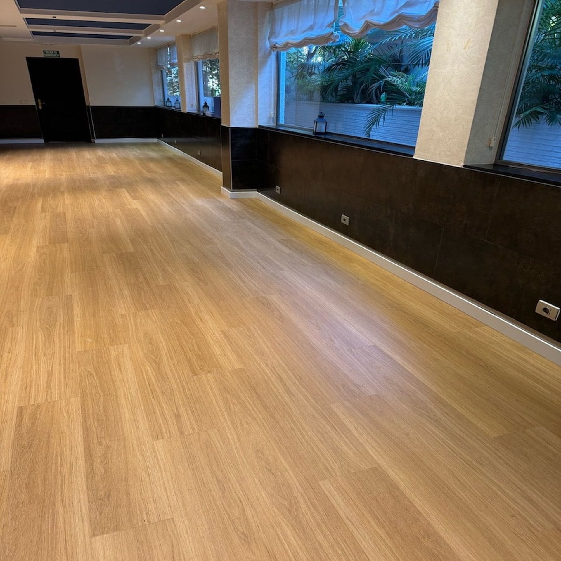 an abstract photo of a curved building with a blue sky in the background