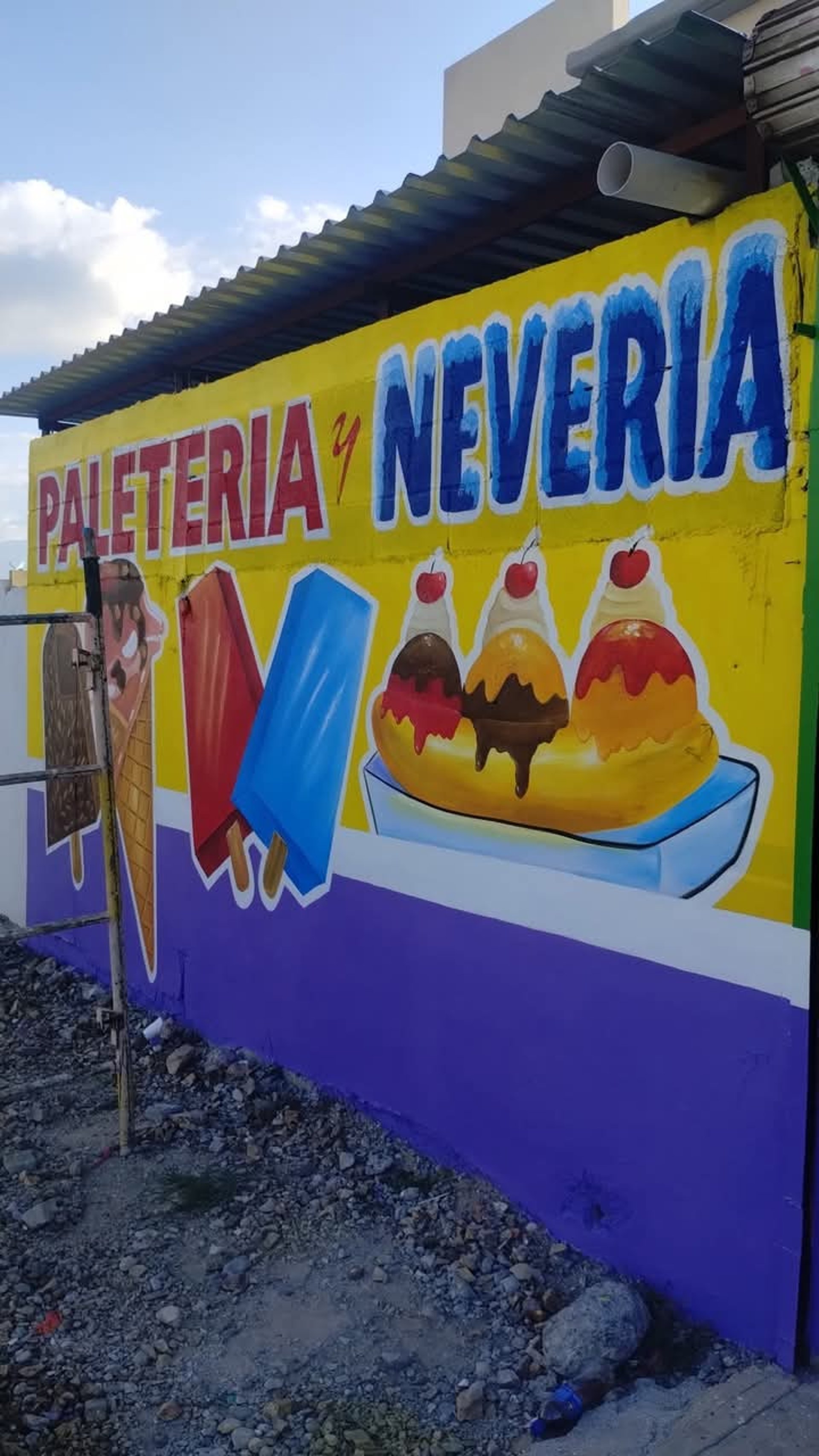 woman wearing yellow long-sleeved dress under white clouds and blue sky during daytime