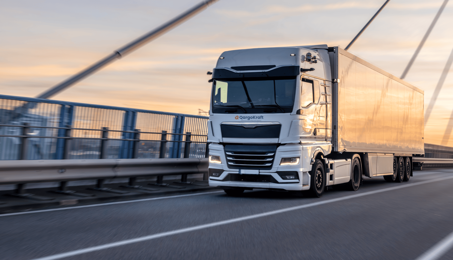 a white semi truck driving down a rural road