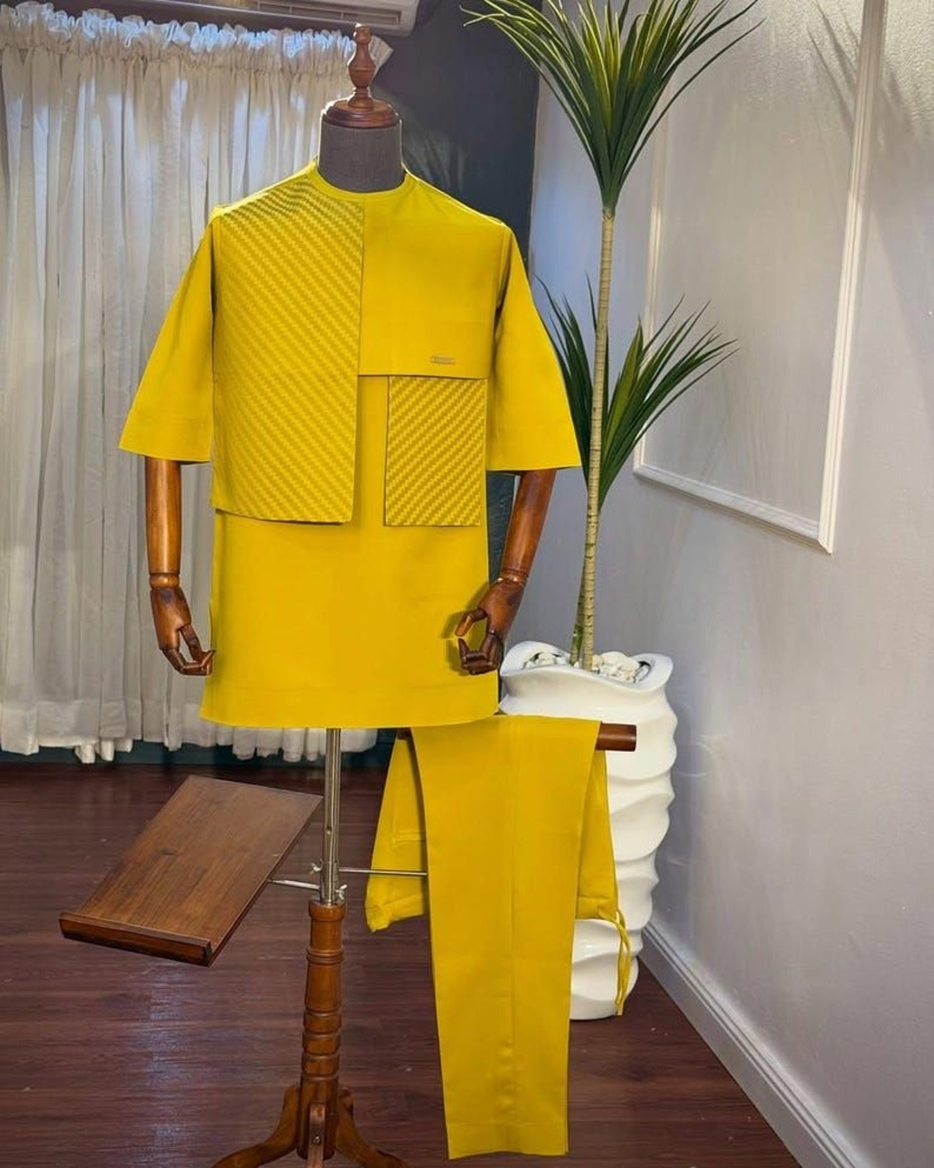 woman wearing yellow long-sleeved dress under white clouds and blue sky during daytime