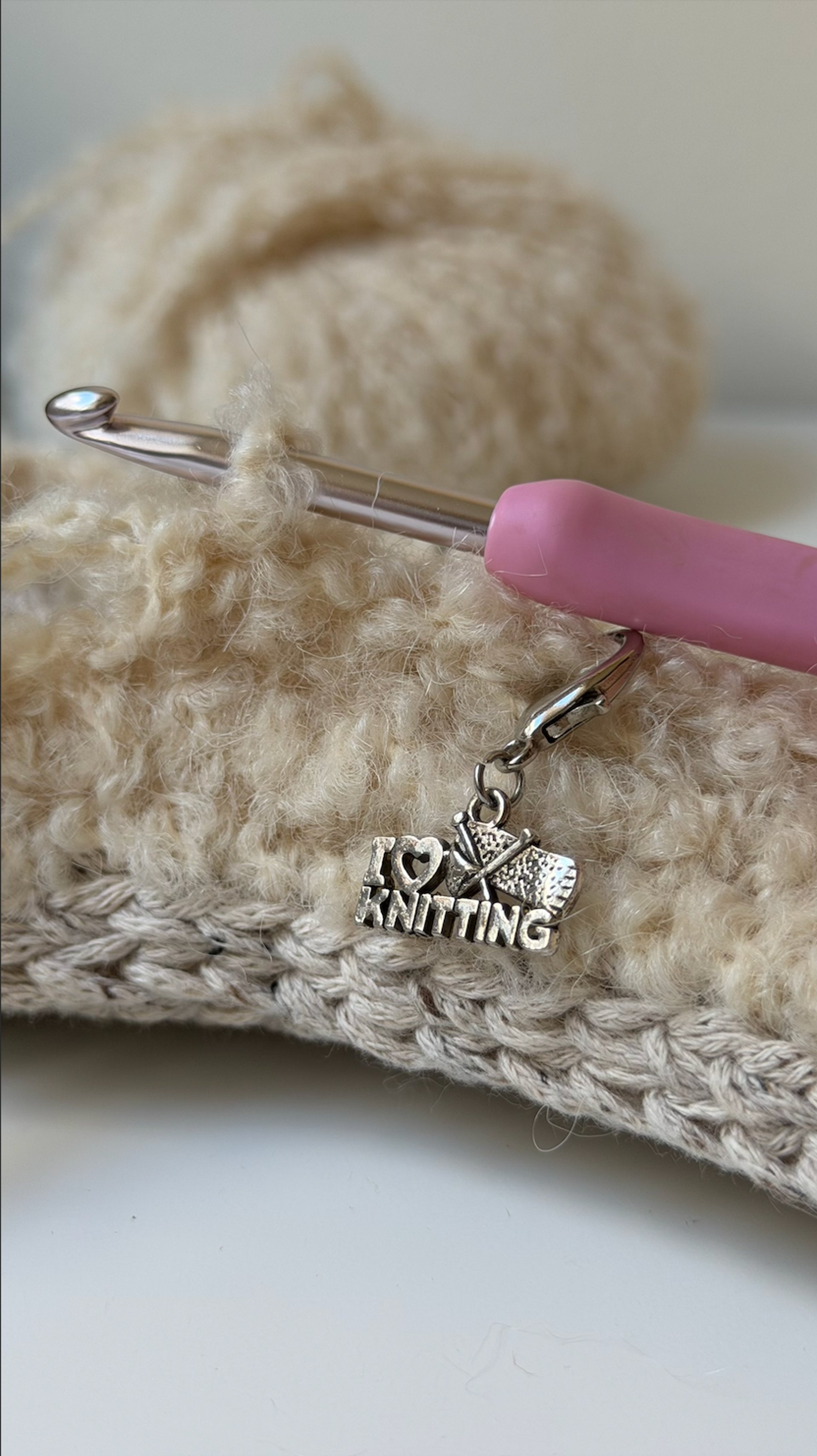 person wearing grey knit sweater