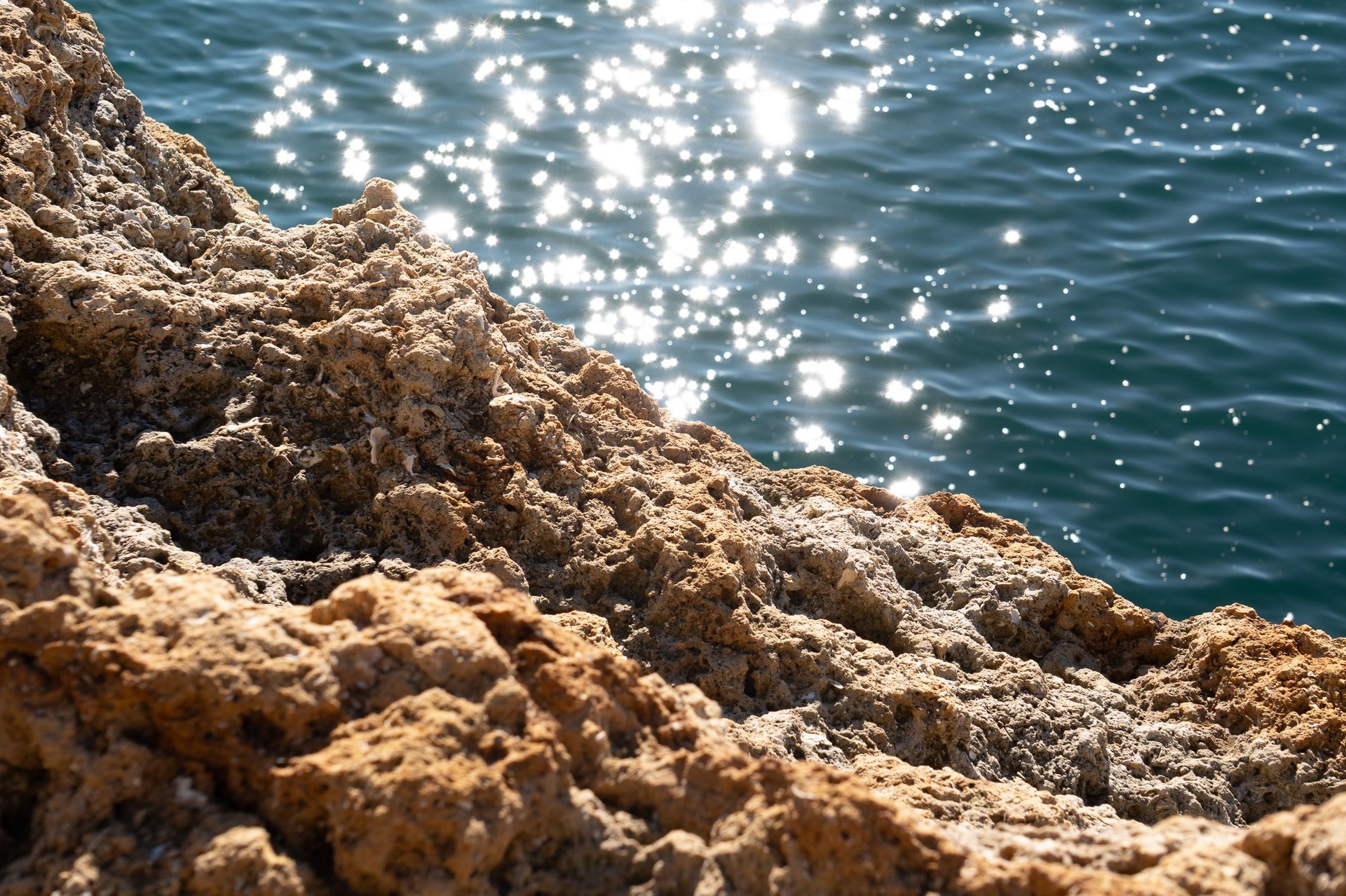 an abstract photo of a curved building with a blue sky in the background