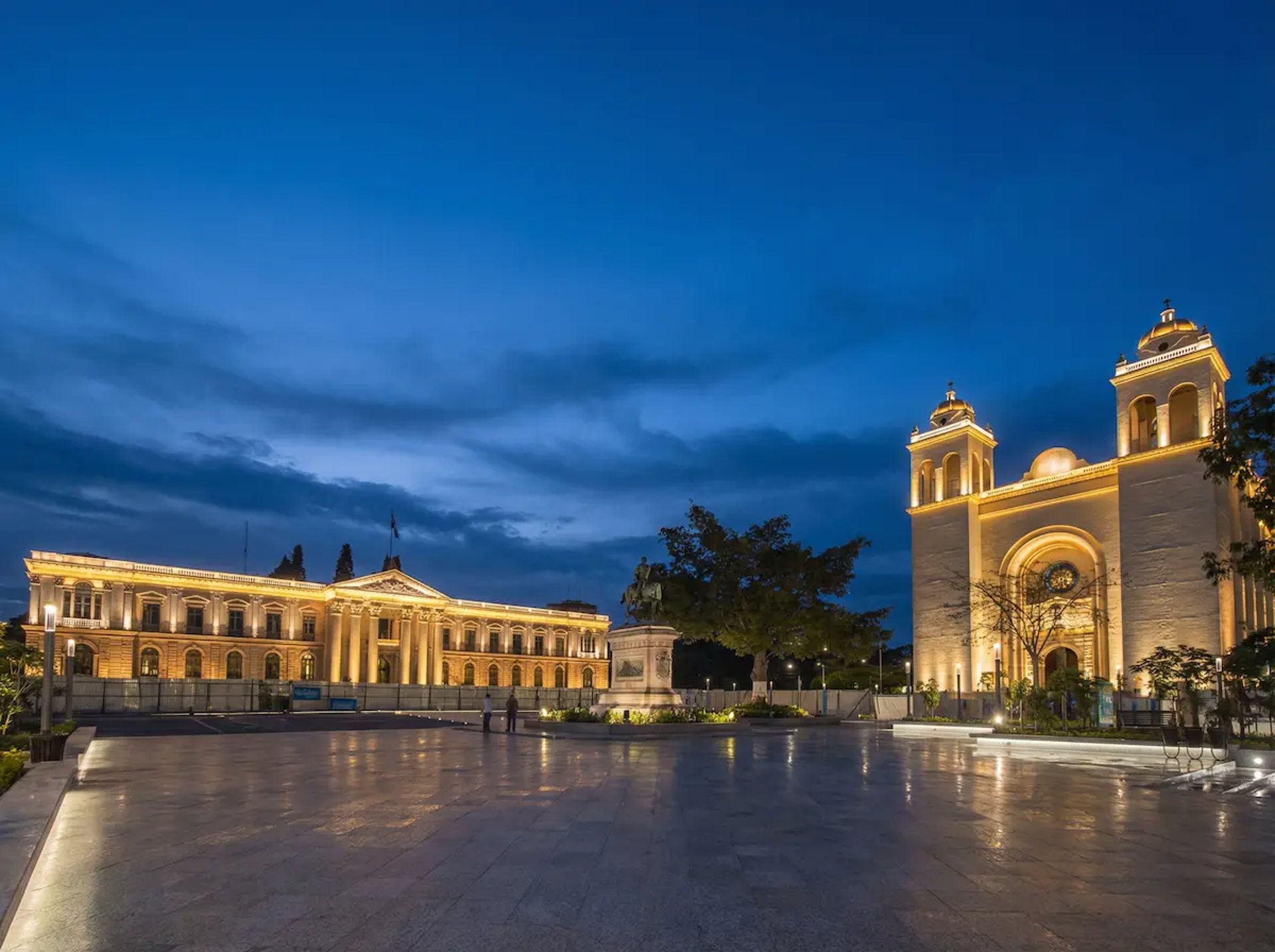 Plaza Barrios in centro San Salvador w palacio national and cathedral evening blue sky