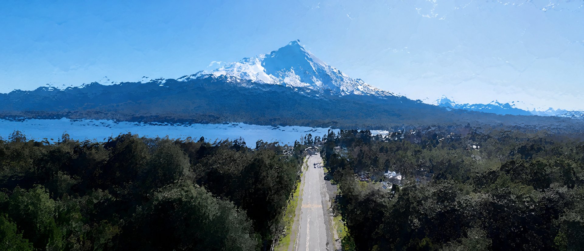 green mountain across body of water