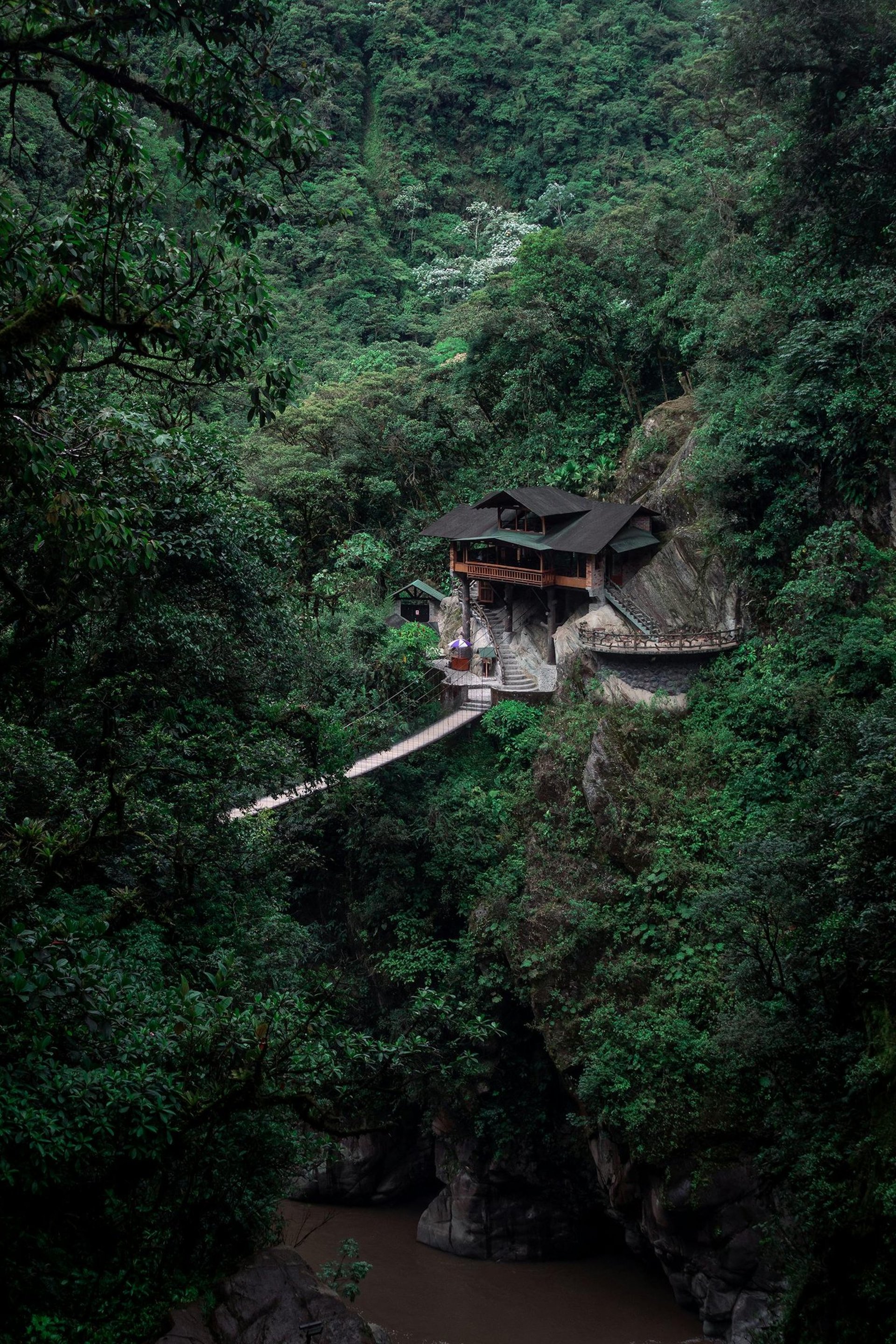 an abstract photo of a curved building with a blue sky in the background