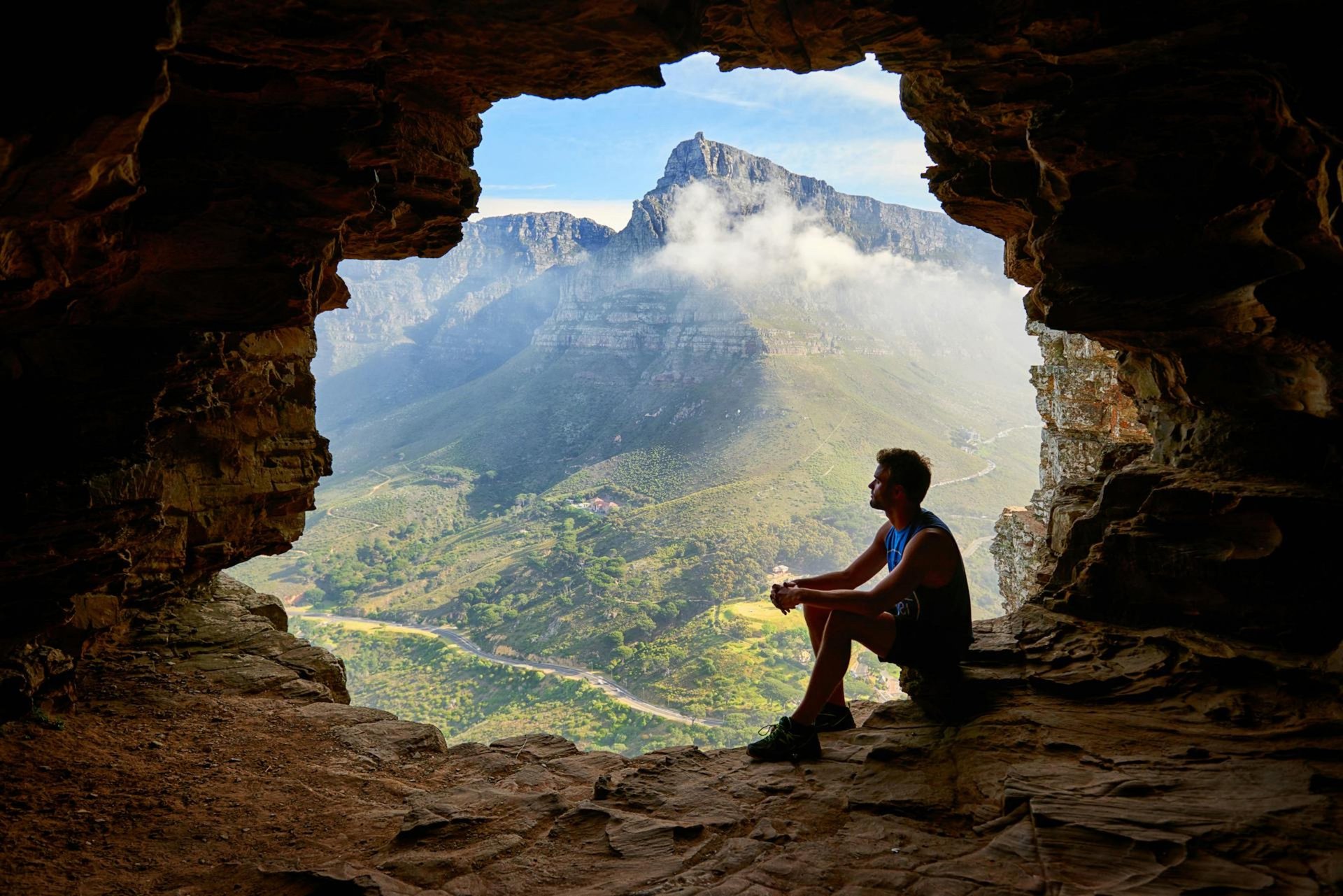 man sitting on ledge