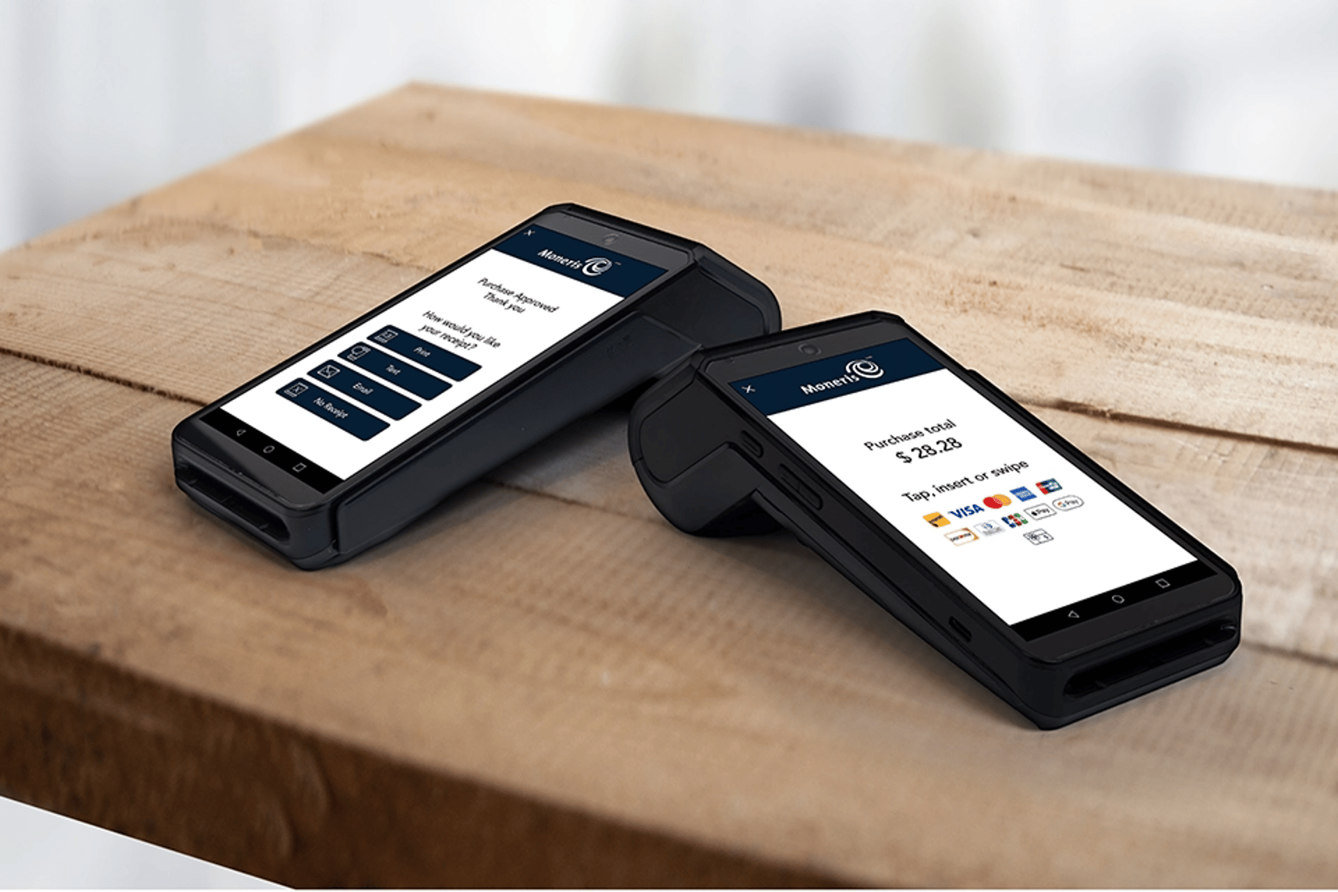 woman standing and holding smartphones