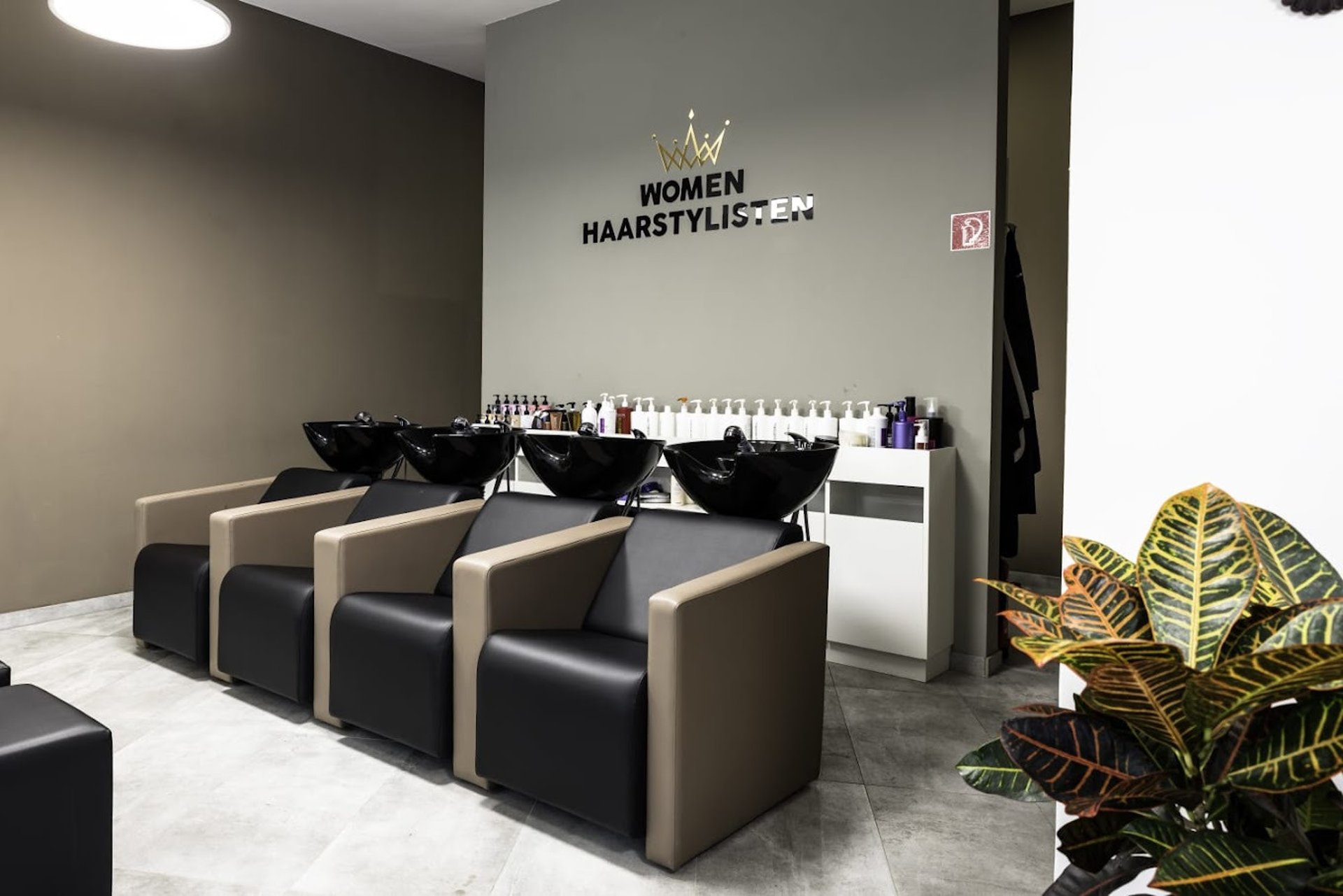 woman lying on blue towel with white cream on face