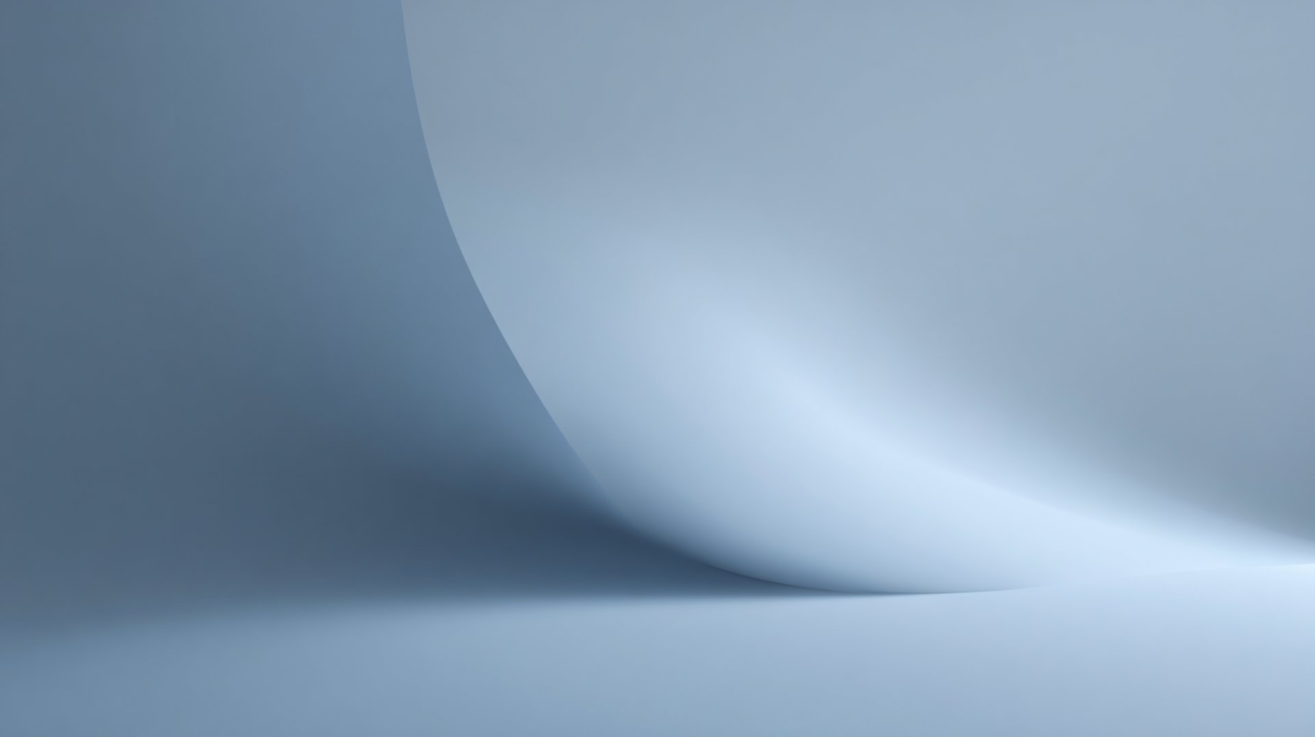 an abstract photo of a curved building with a blue sky in the background