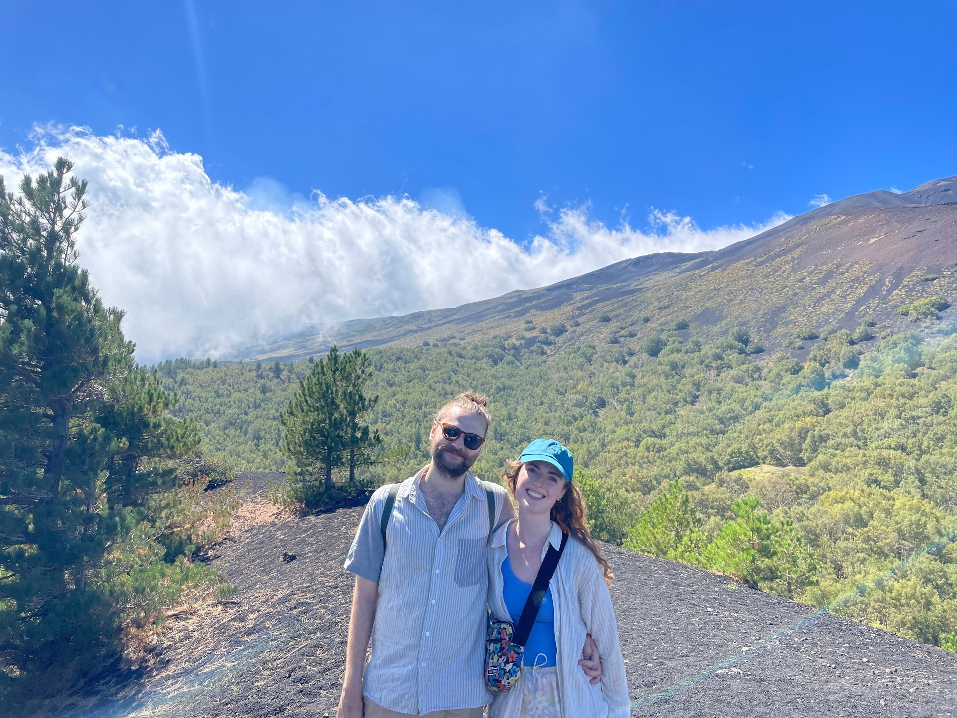 an abstract photo of a curved building with a blue sky in the background