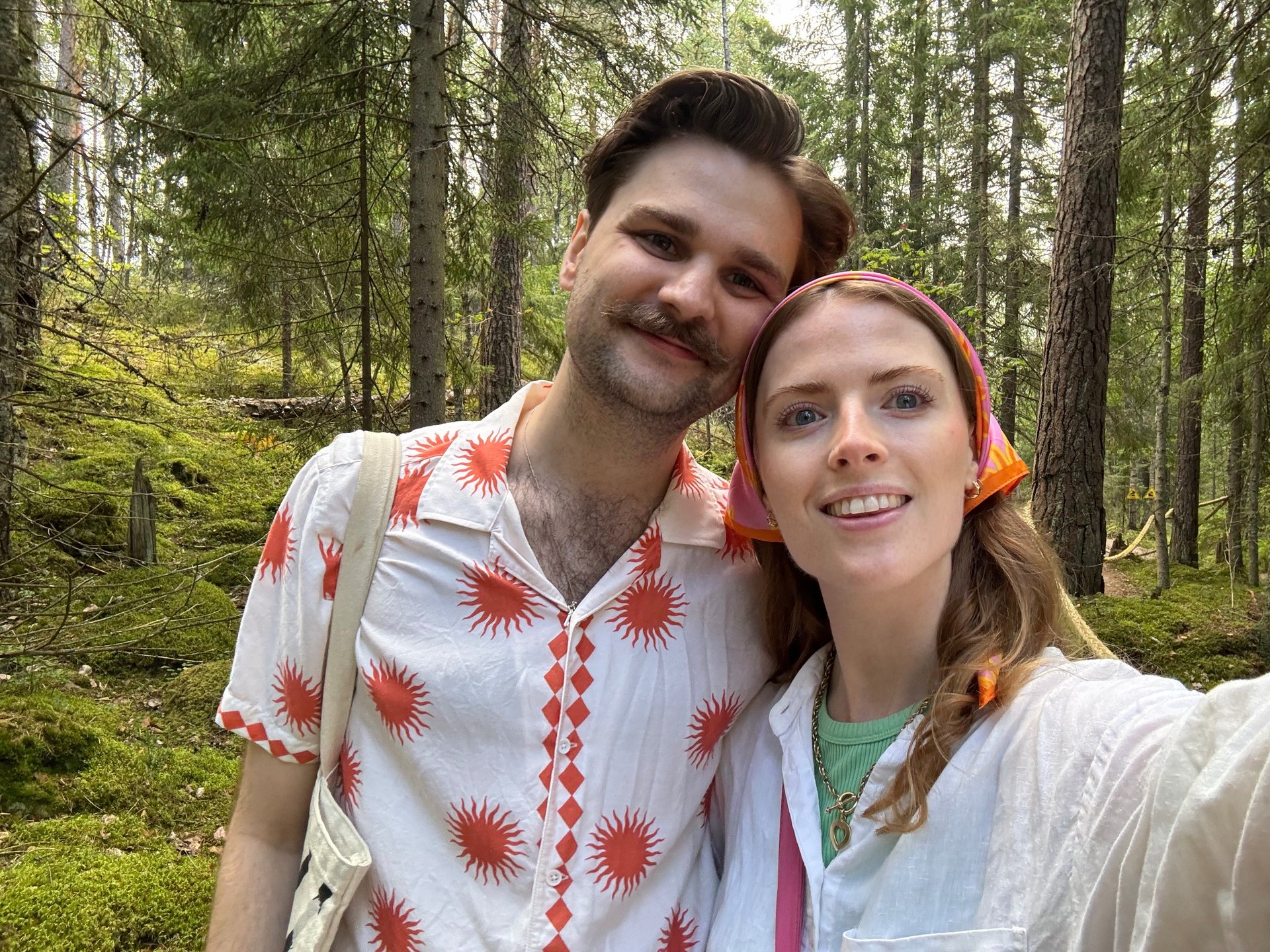 an abstract photo of a curved building with a blue sky in the background