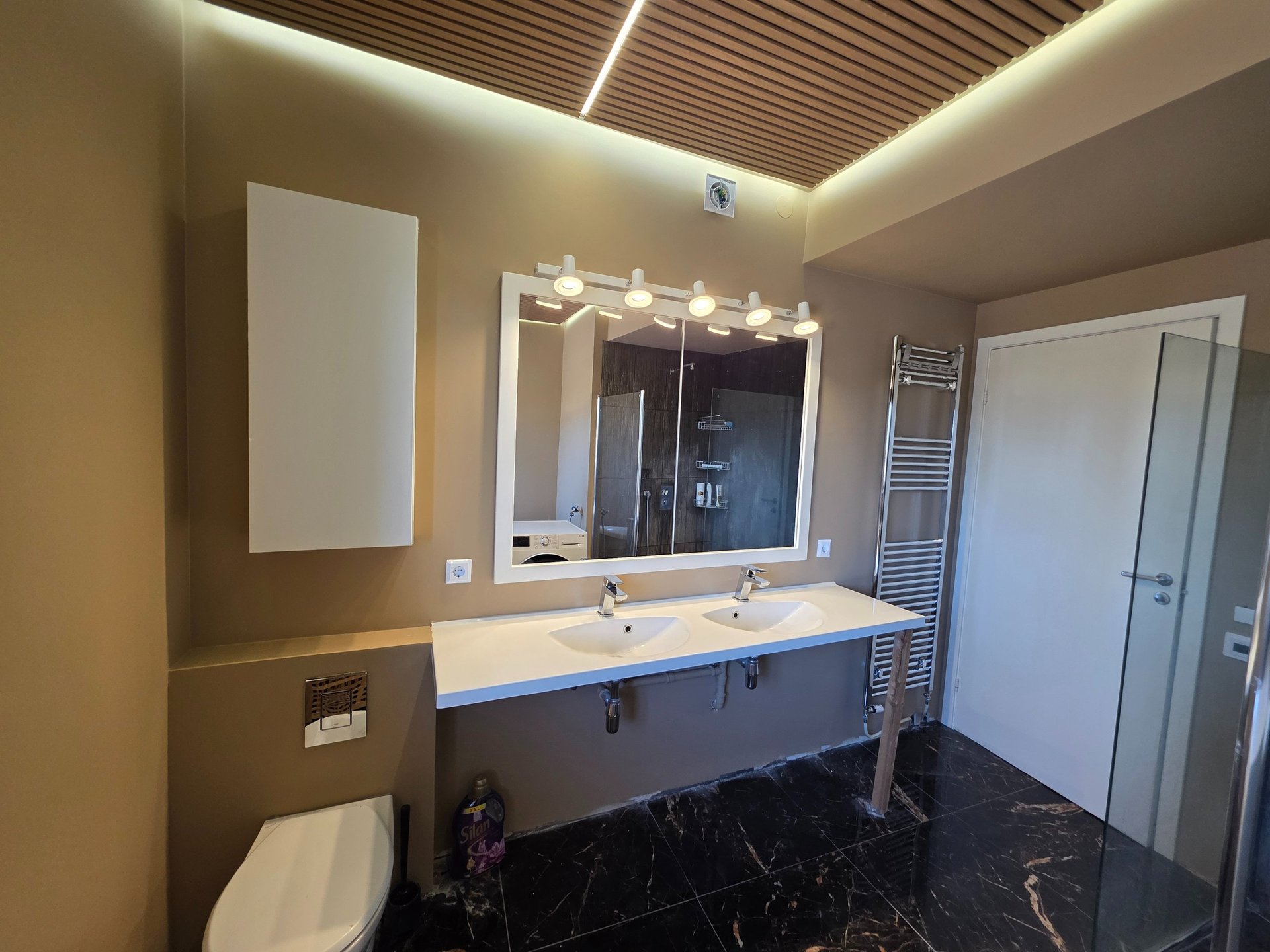 black and brown leather padded tub sofa