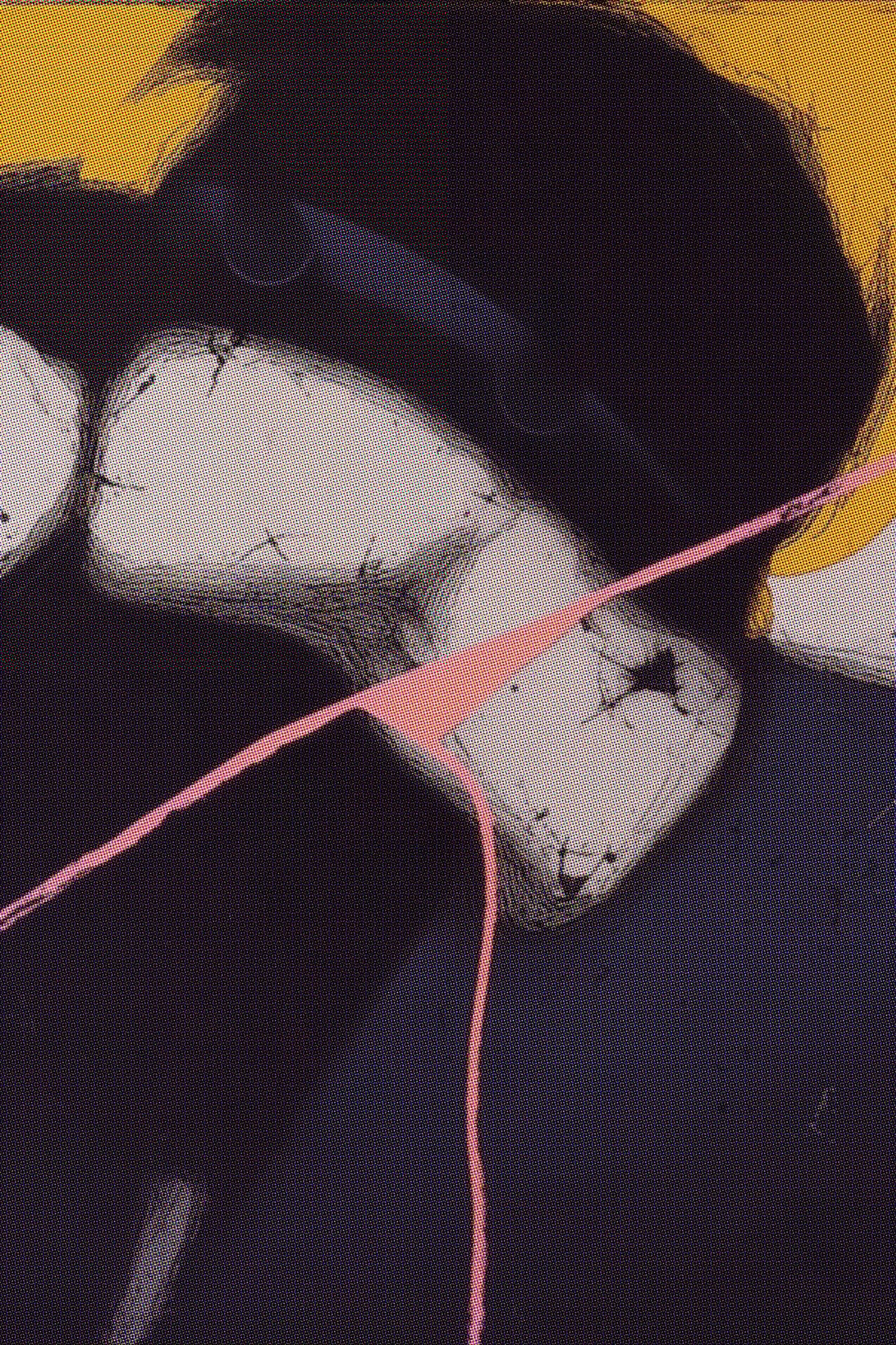 a close up of a black and brown abstract painting