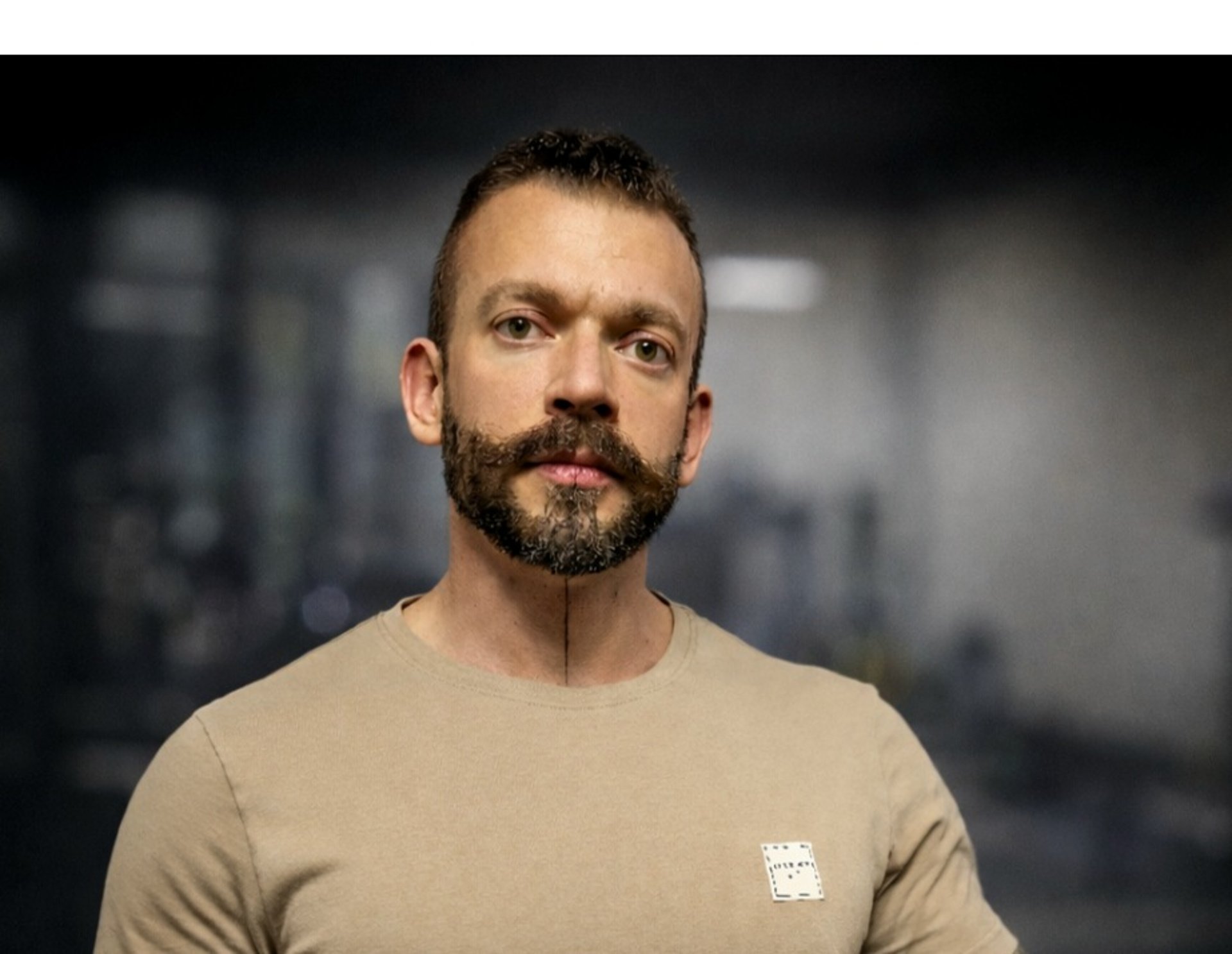an abstract photo of a curved building with a blue sky in the background