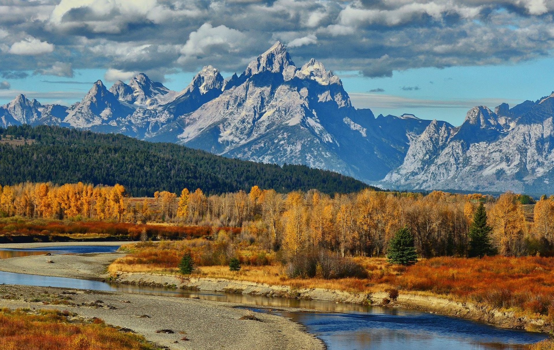 green grass field and mountains during daytime