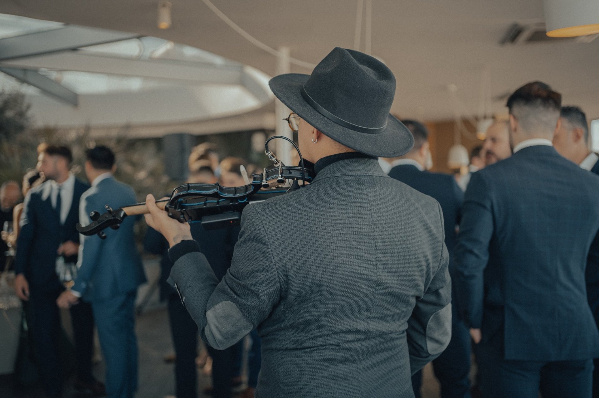 an abstract photo of a curved building with a blue sky in the background