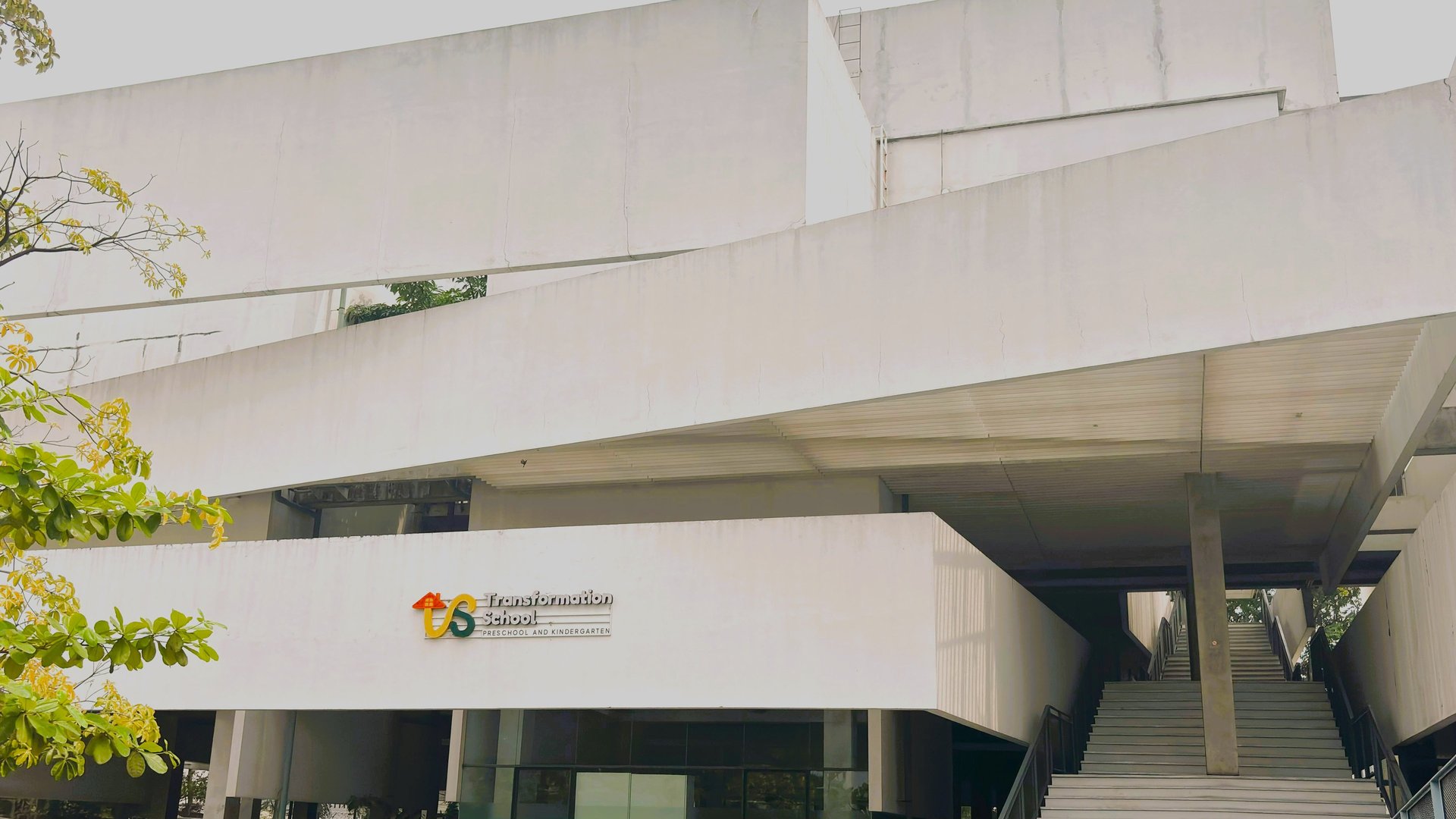 an abstract photo of a curved building with a blue sky in the background