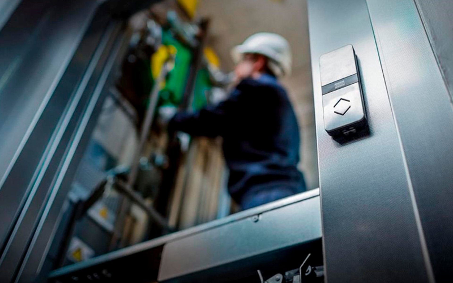 an abstract photo of a curved building with a blue sky in the background