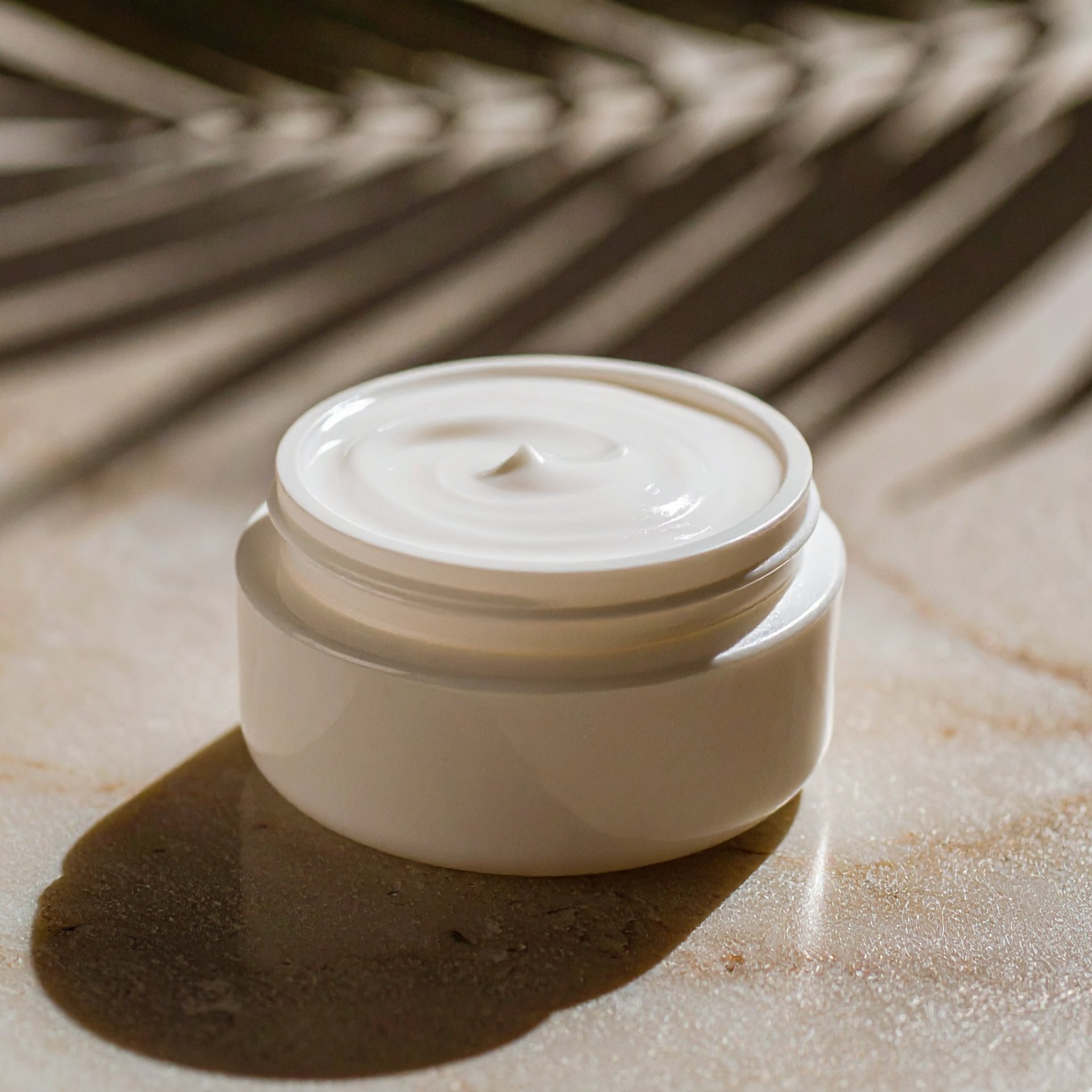 an abstract photo of a curved building with a blue sky in the background