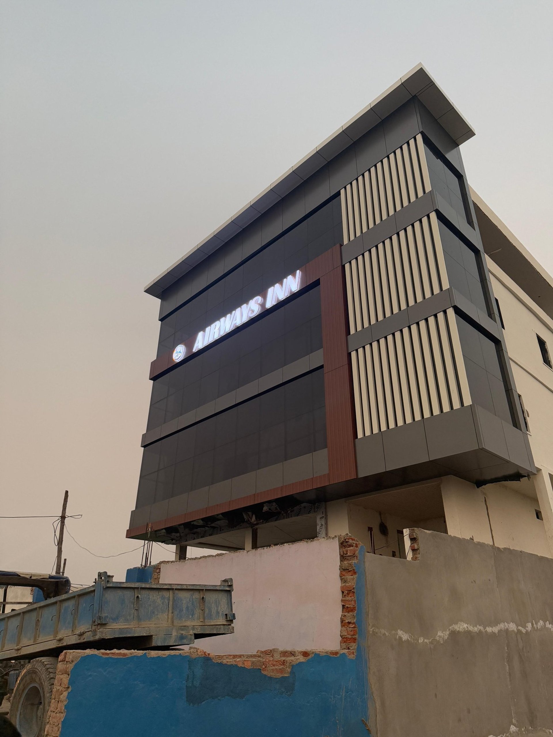 a bedroom with a bed and a night stand