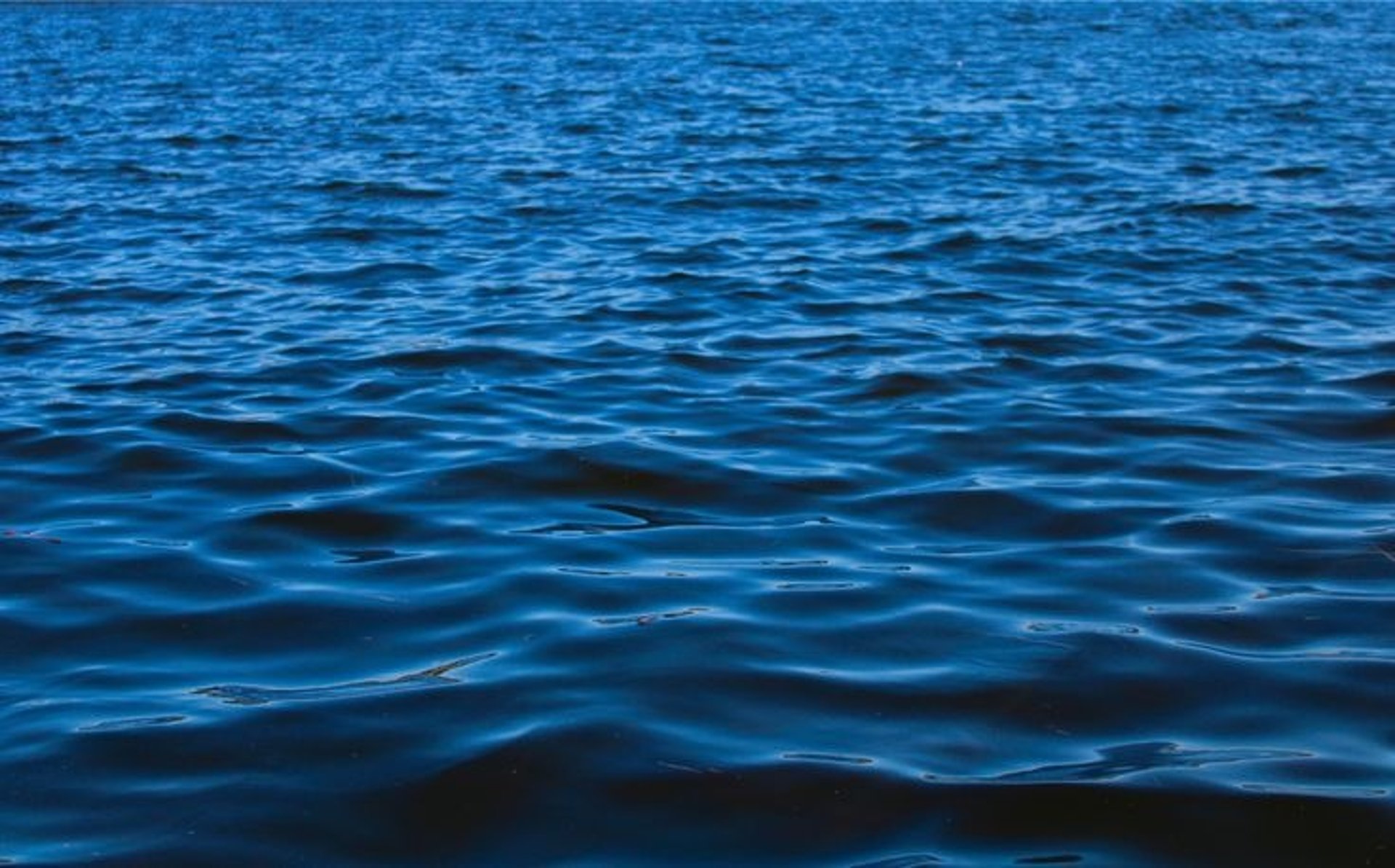 woman wearing yellow long-sleeved dress under white clouds and blue sky during daytime
