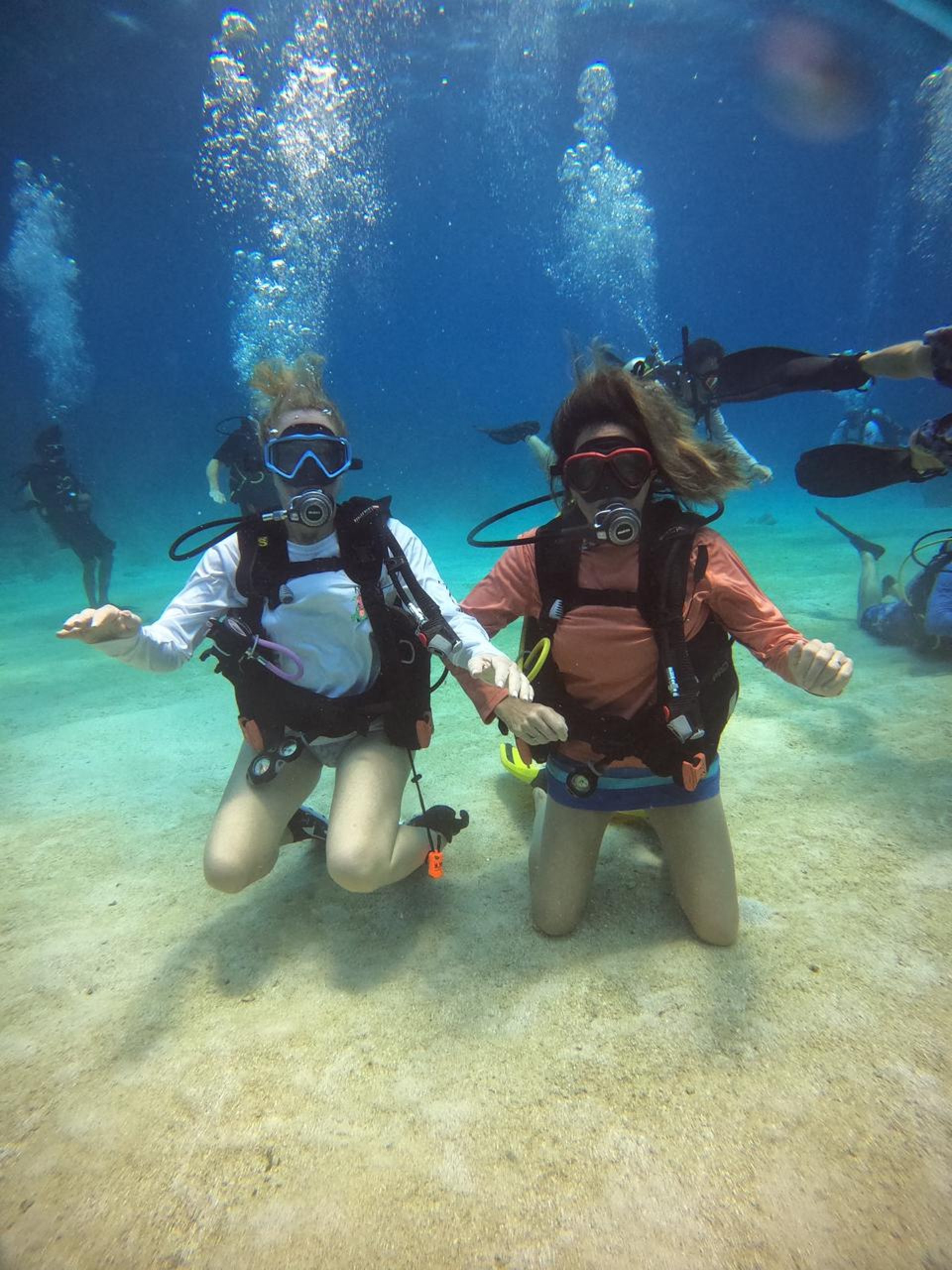 a man riding a zip line in the middle of a forest