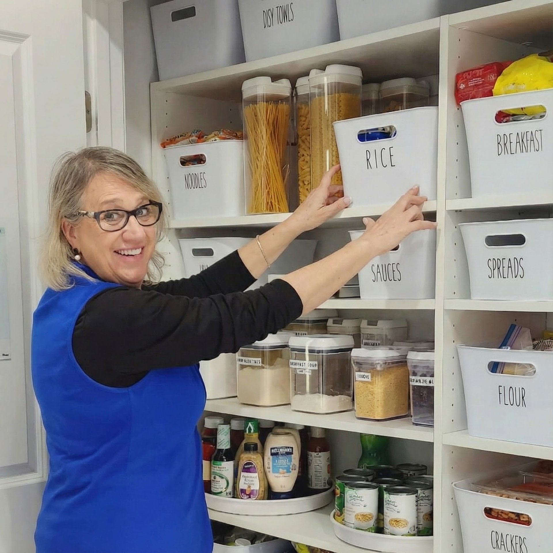 Bedroom with tufted headboard and open closet.