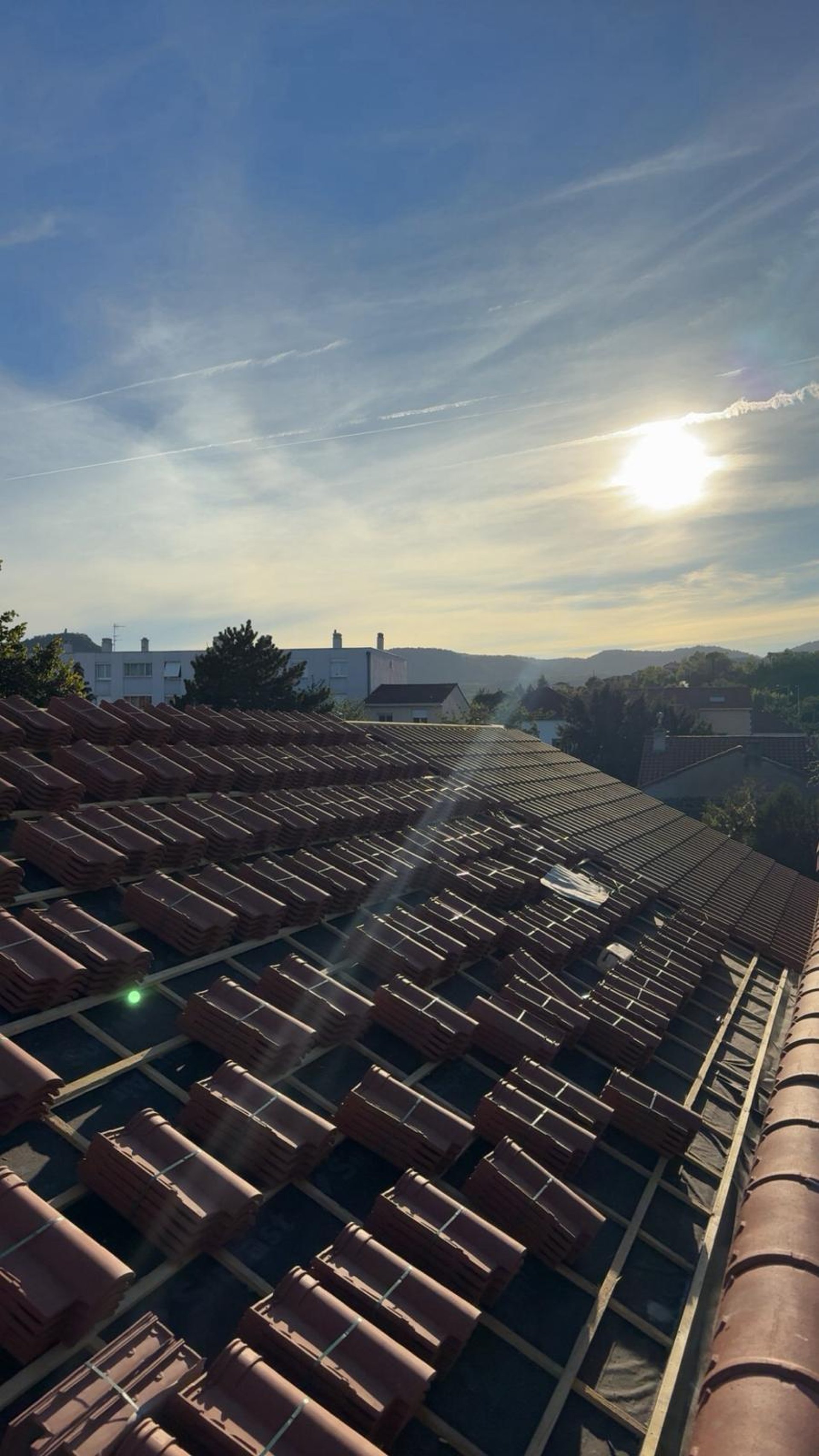 a person wearing blue gloves and holding a hammer