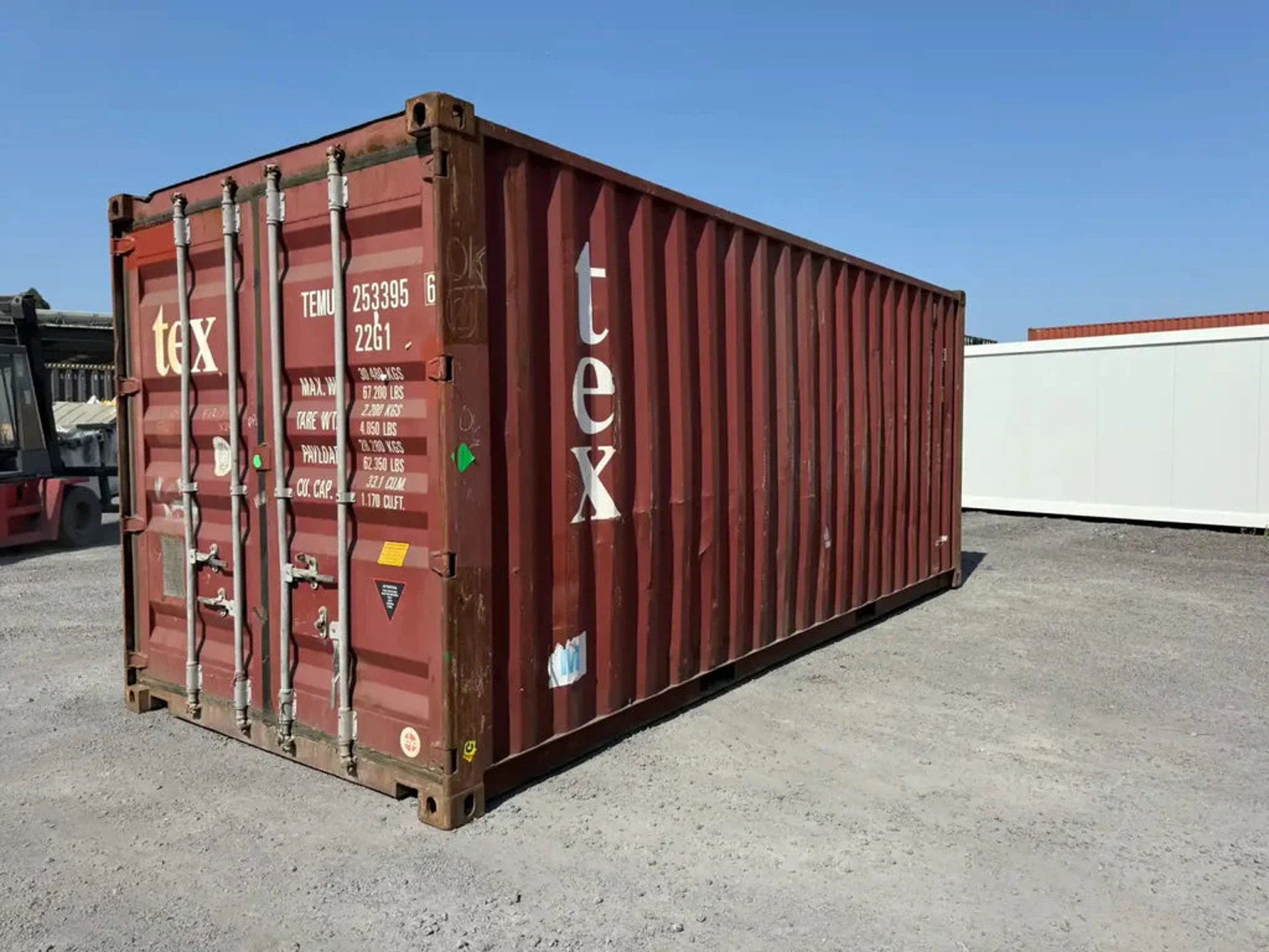 an abstract photo of a curved building with a blue sky in the background