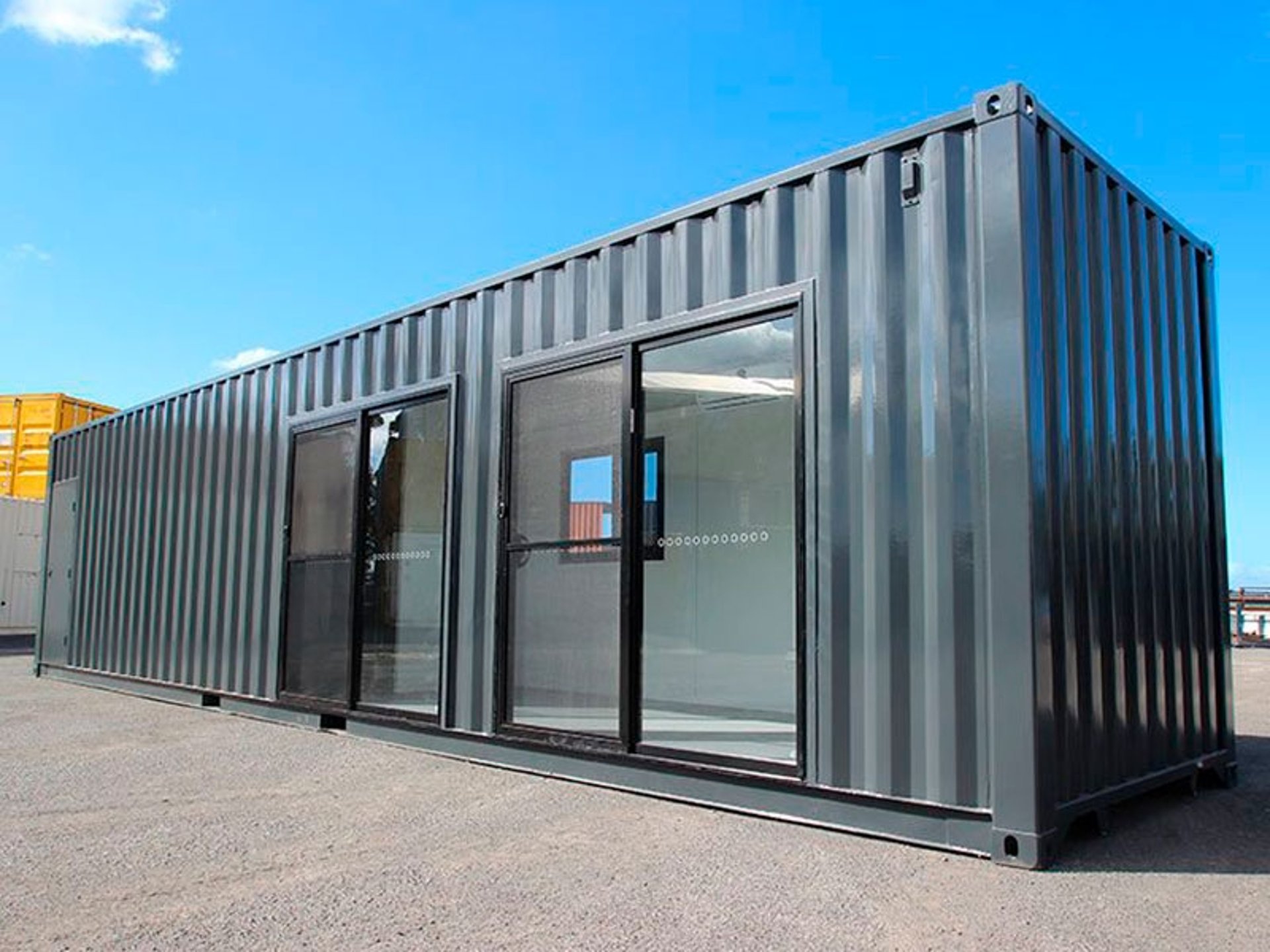 an abstract photo of a curved building with a blue sky in the background