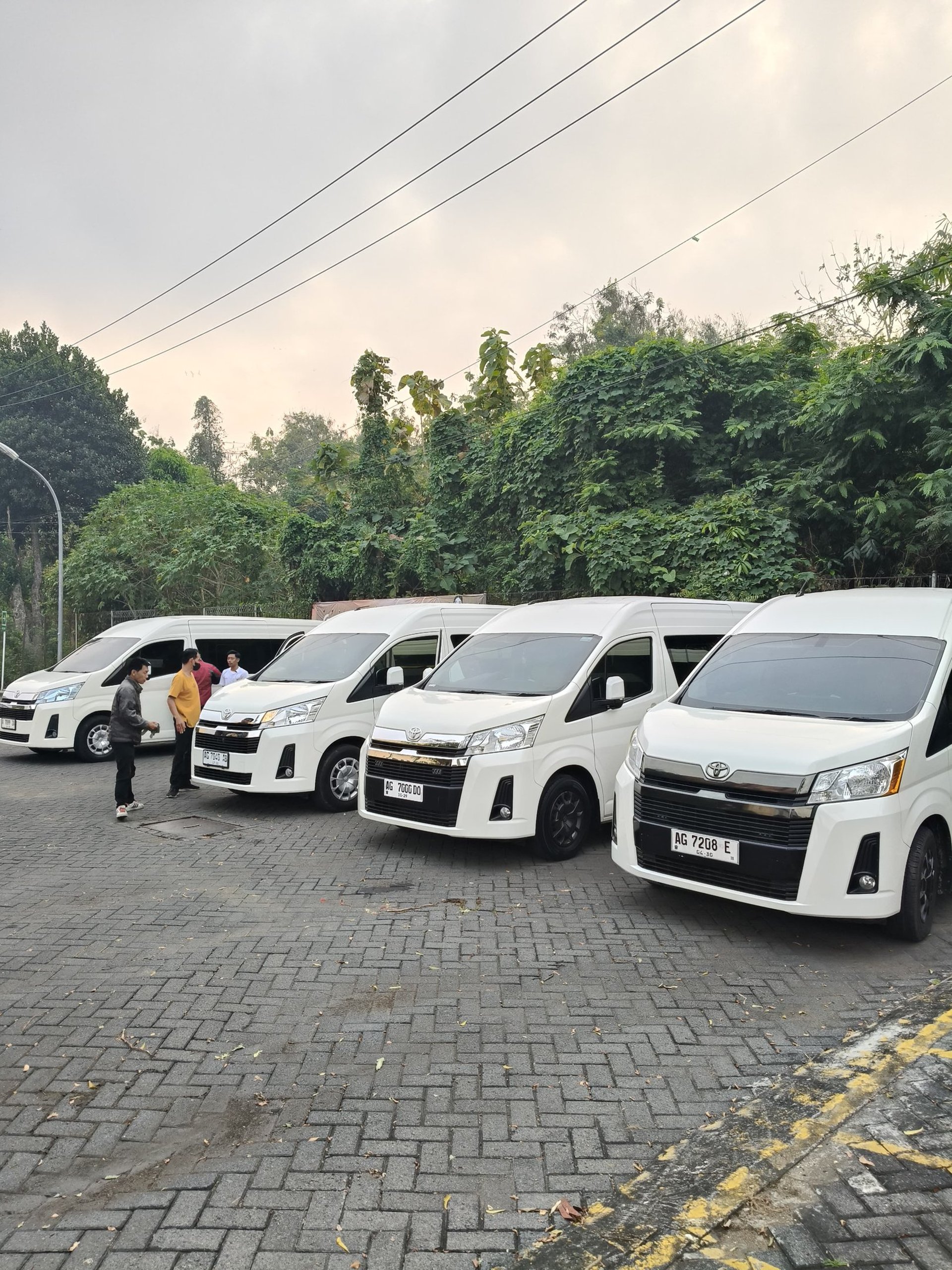 woman wearing yellow long-sleeved dress under white clouds and blue sky during daytime