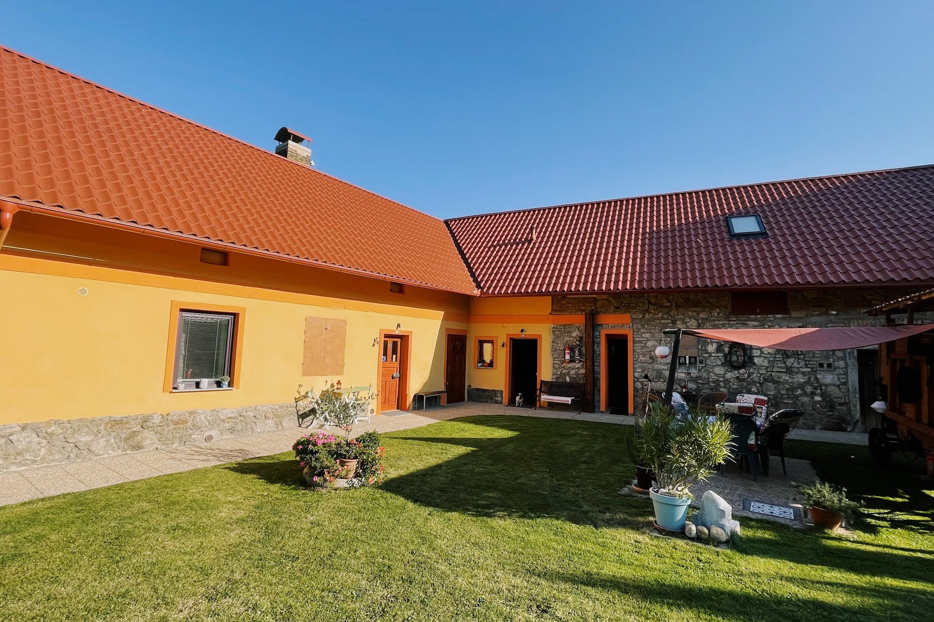 an abstract photo of a curved building with a blue sky in the background