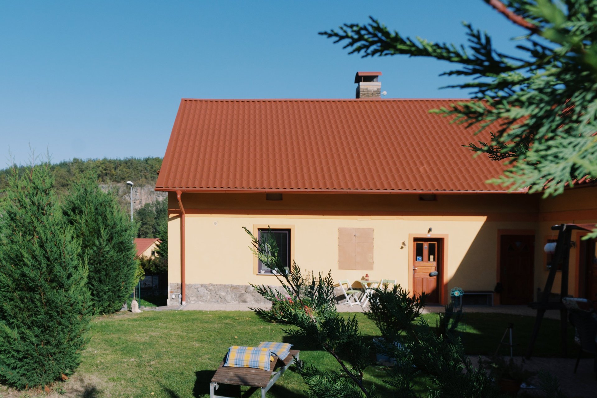 an abstract photo of a curved building with a blue sky in the background