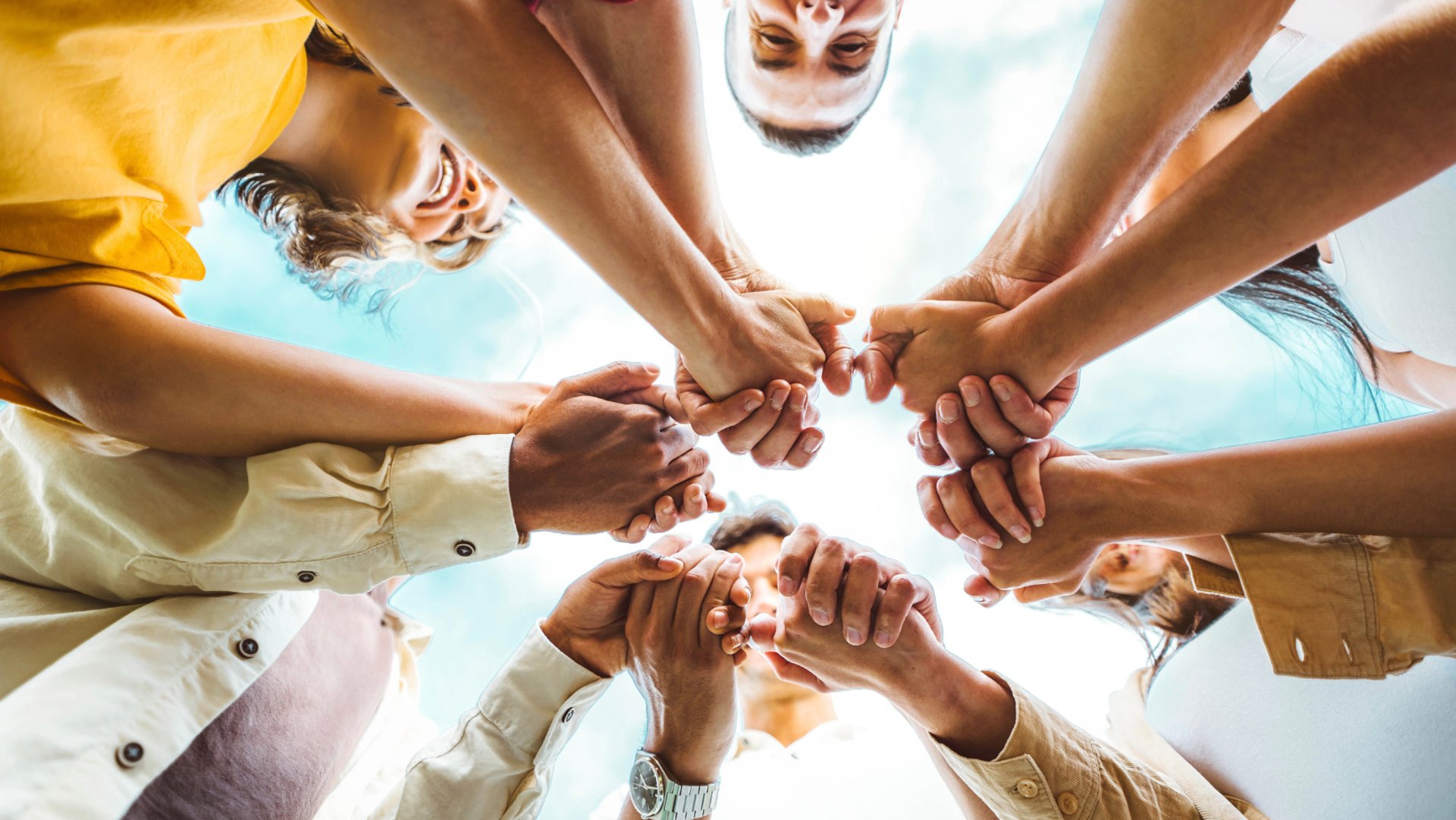 an abstract photo of a curved building with a blue sky in the background