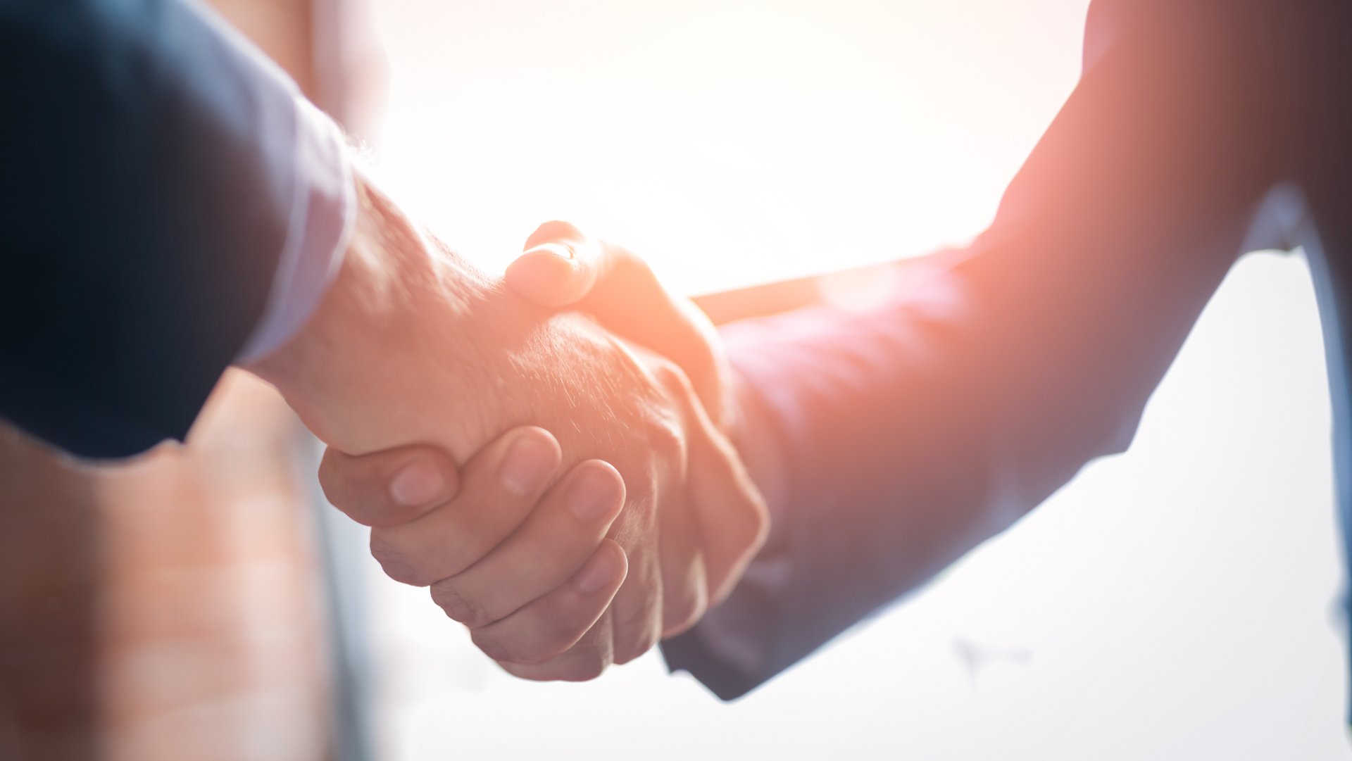 an abstract photo of a curved building with a blue sky in the background