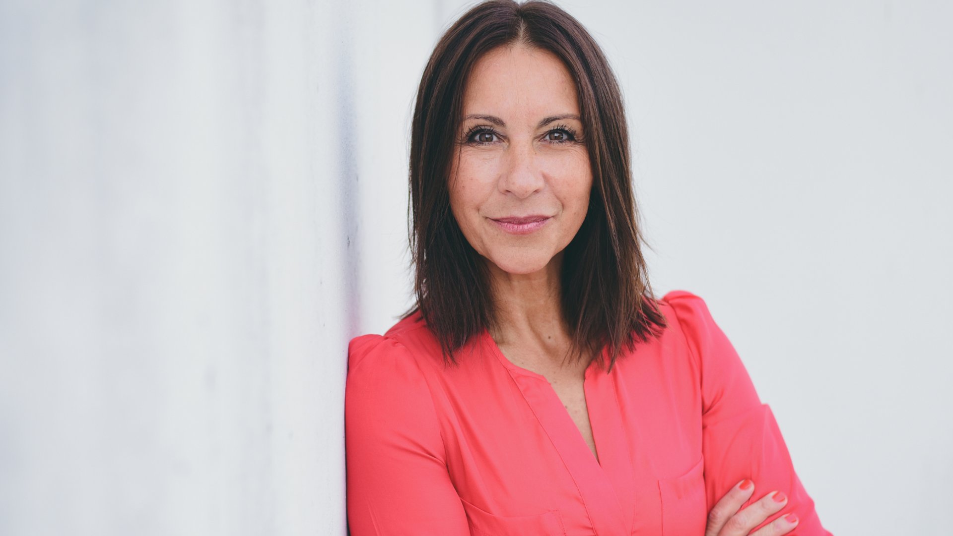 an abstract photo of a curved building with a blue sky in the background