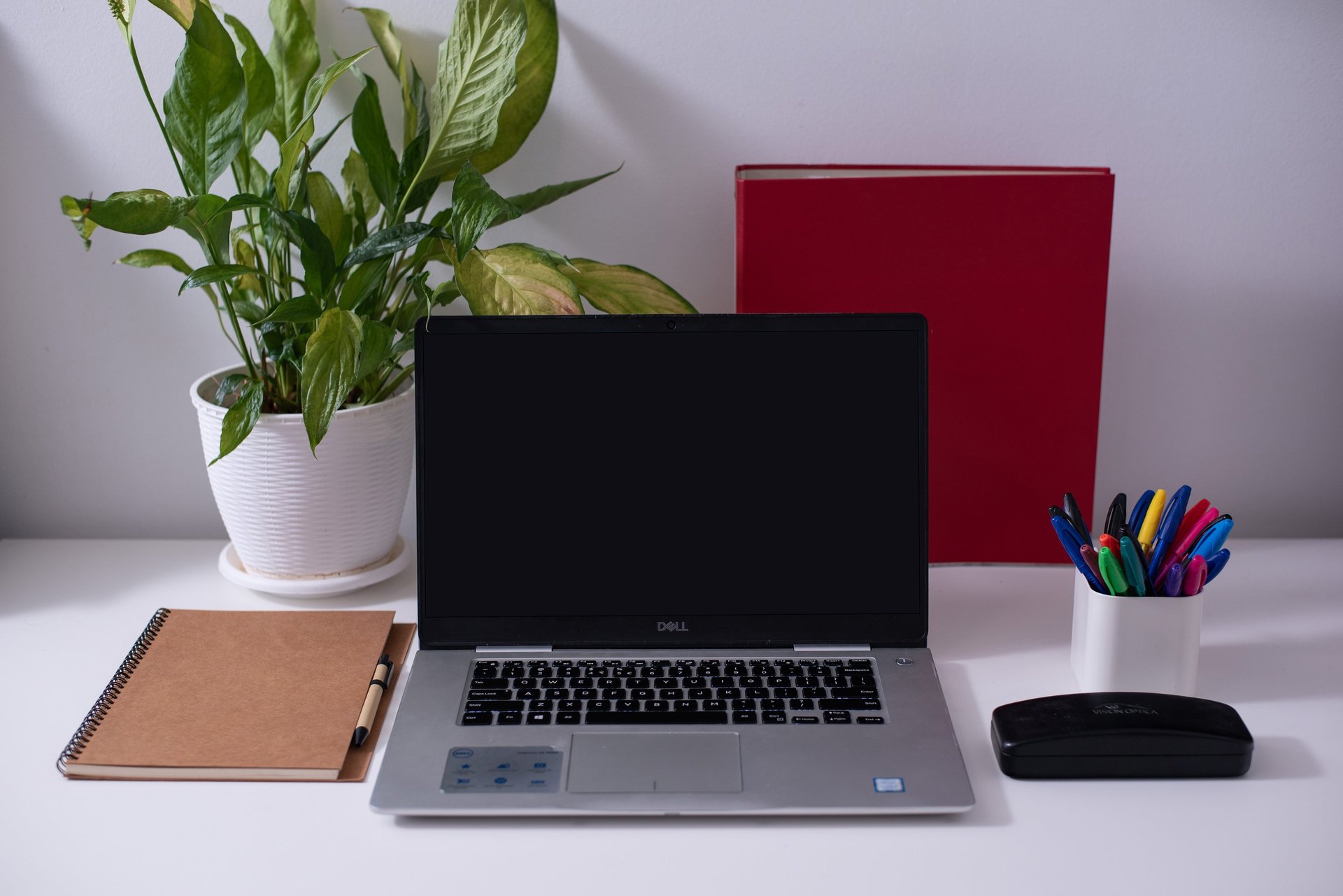 black nikon dslr camera on white printer paper