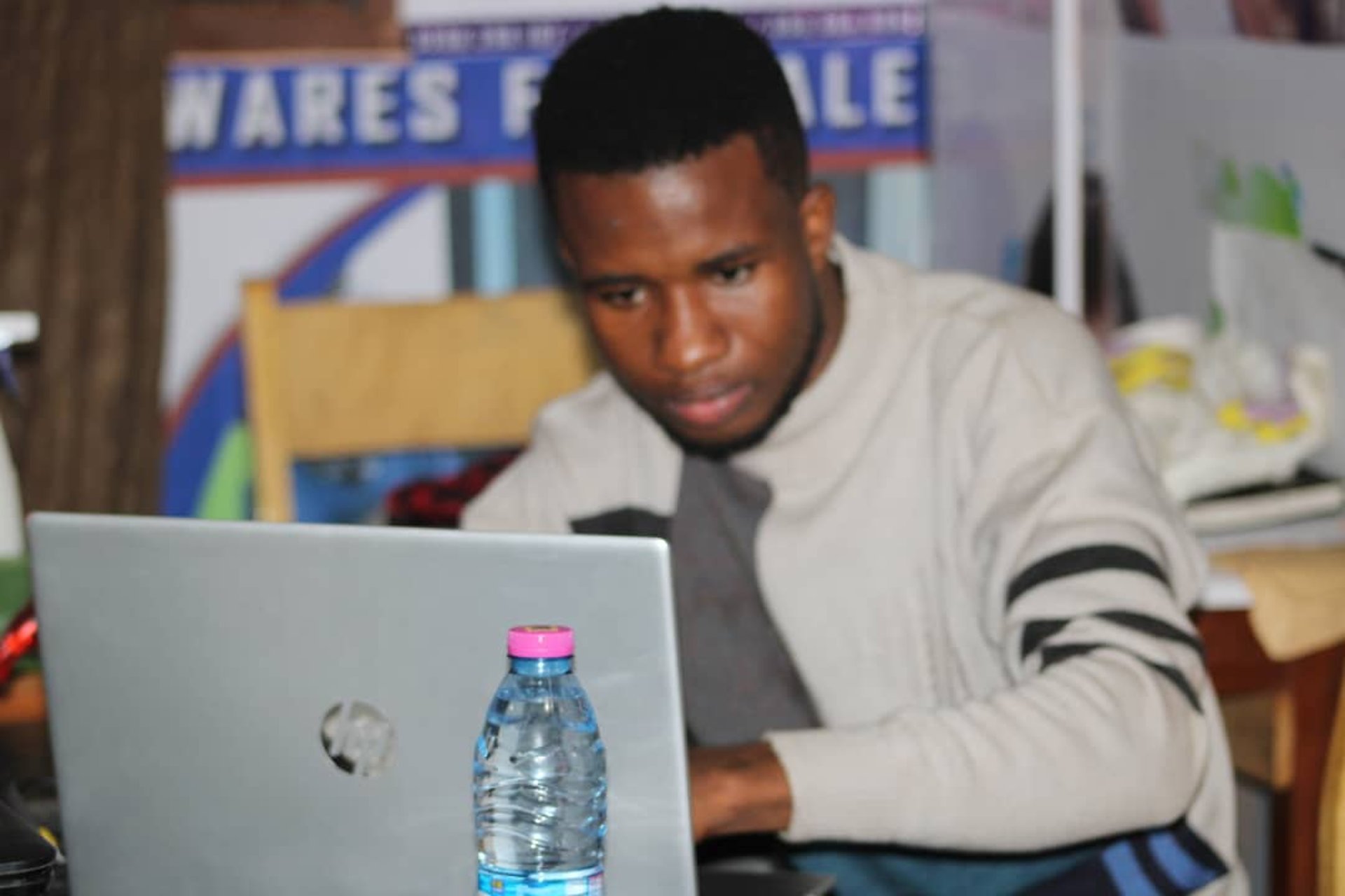 Doctor consulting patient via video call on laptop.