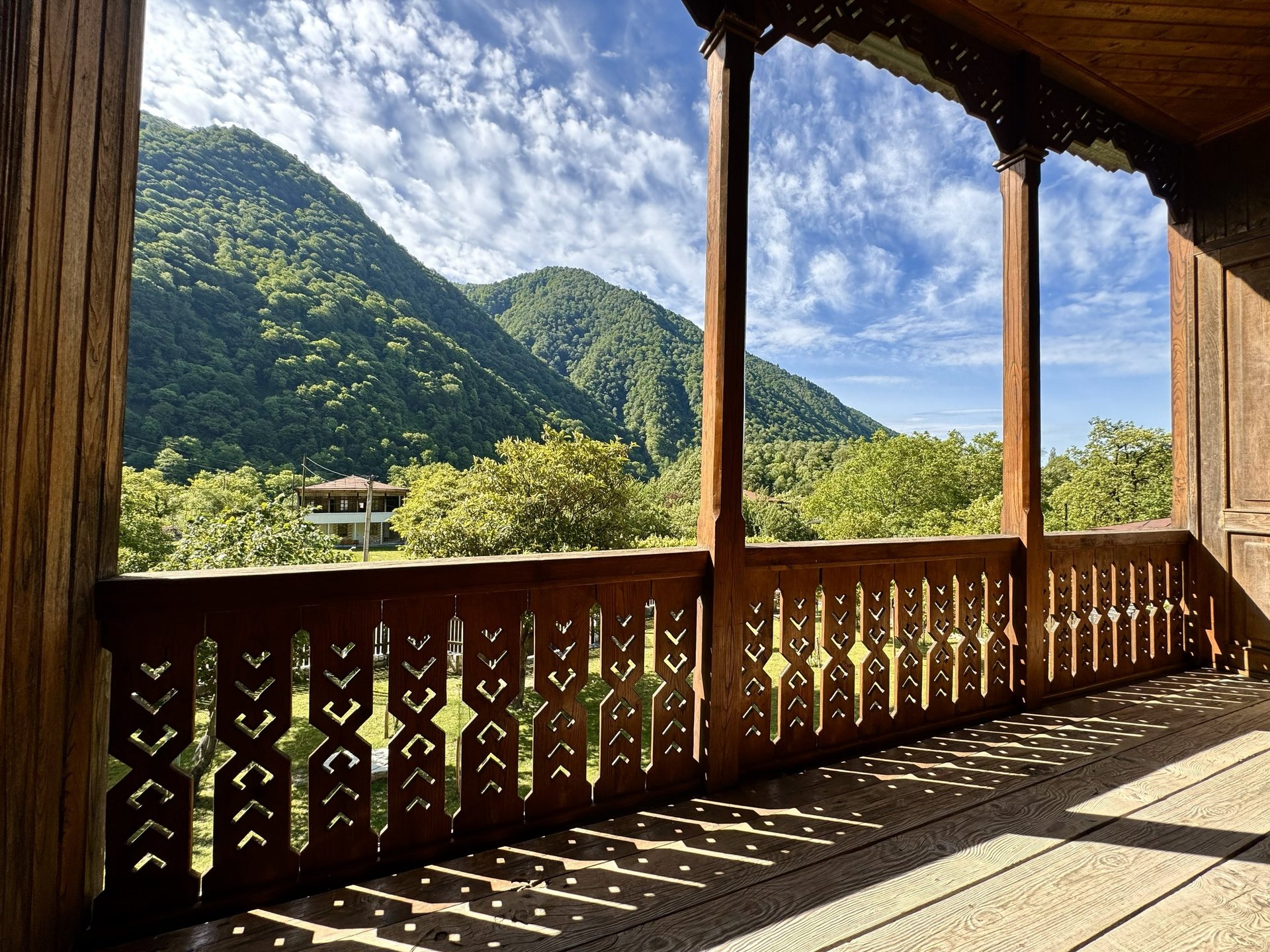 an abstract photo of a curved building with a blue sky in the background