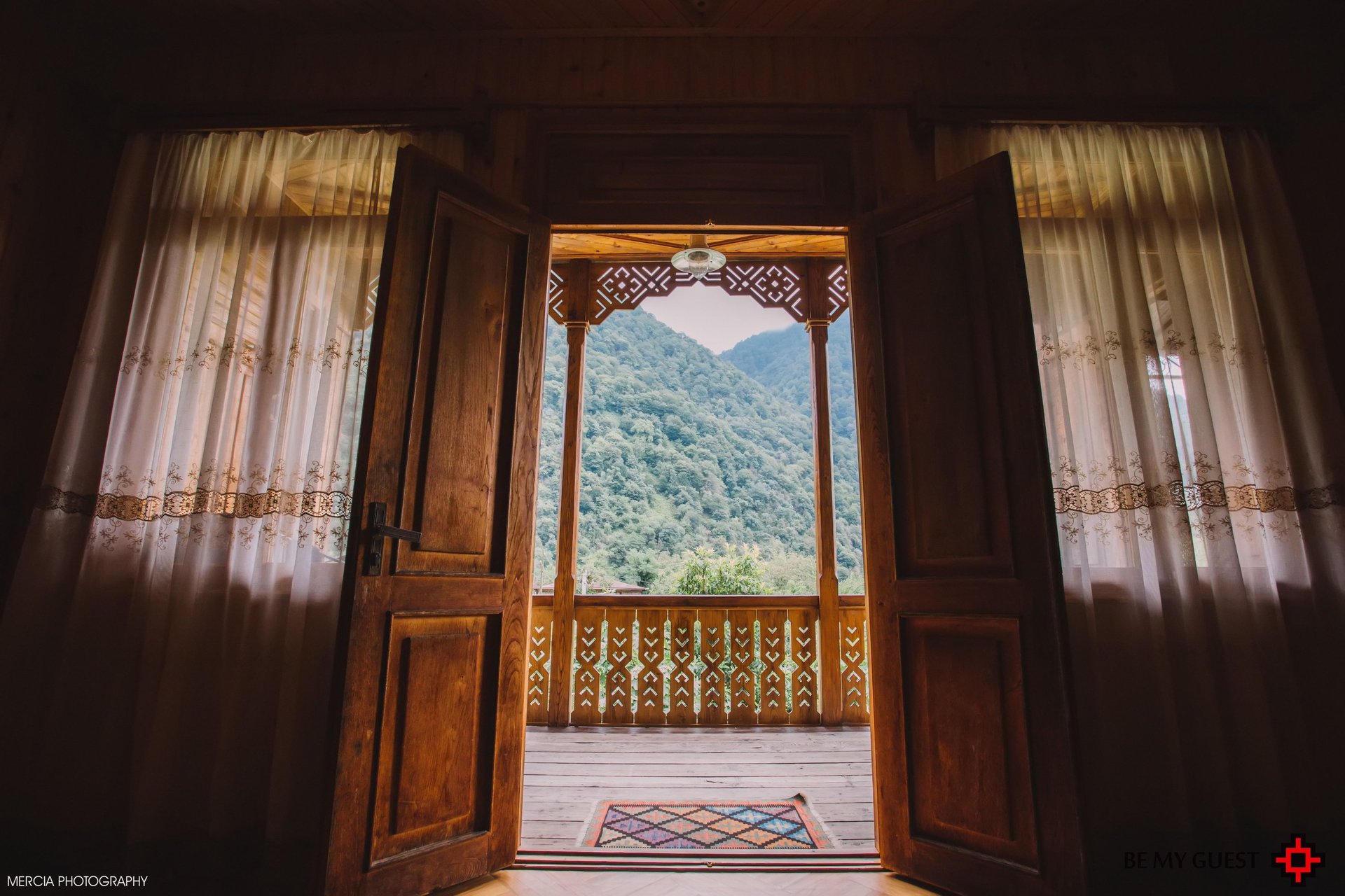 an abstract photo of a curved building with a blue sky in the background