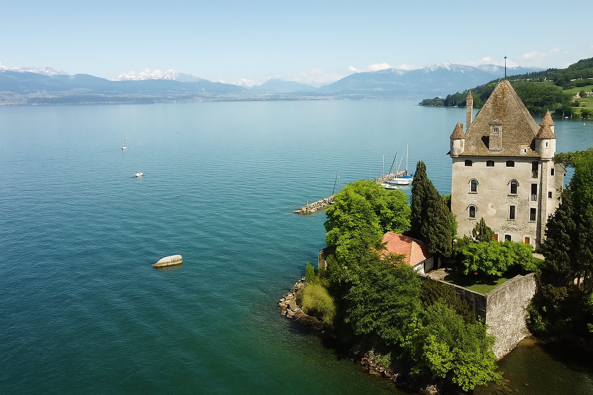 brown concrete building near body of water during daytime