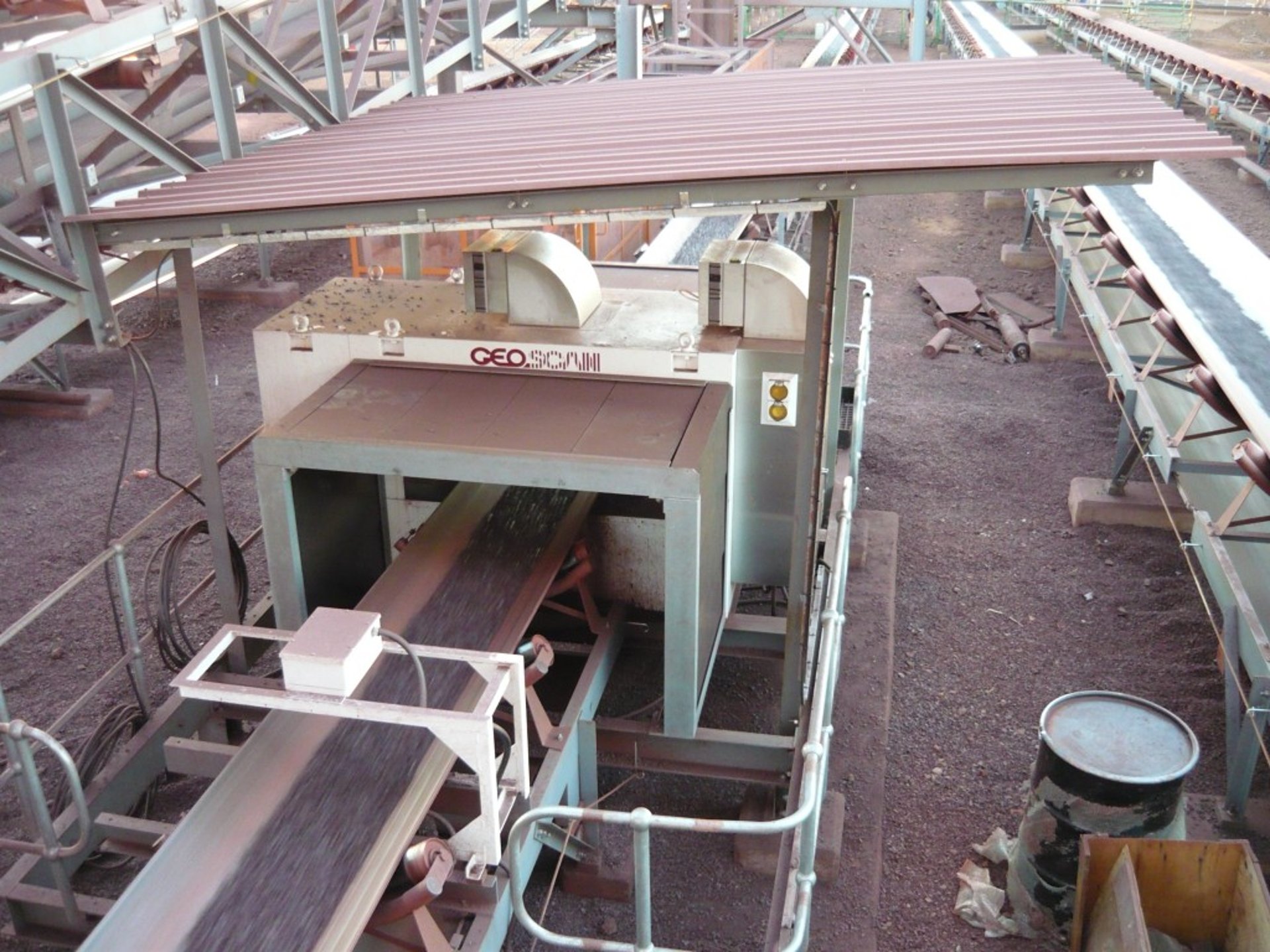 a couple of trucks that are sitting in the dirt
