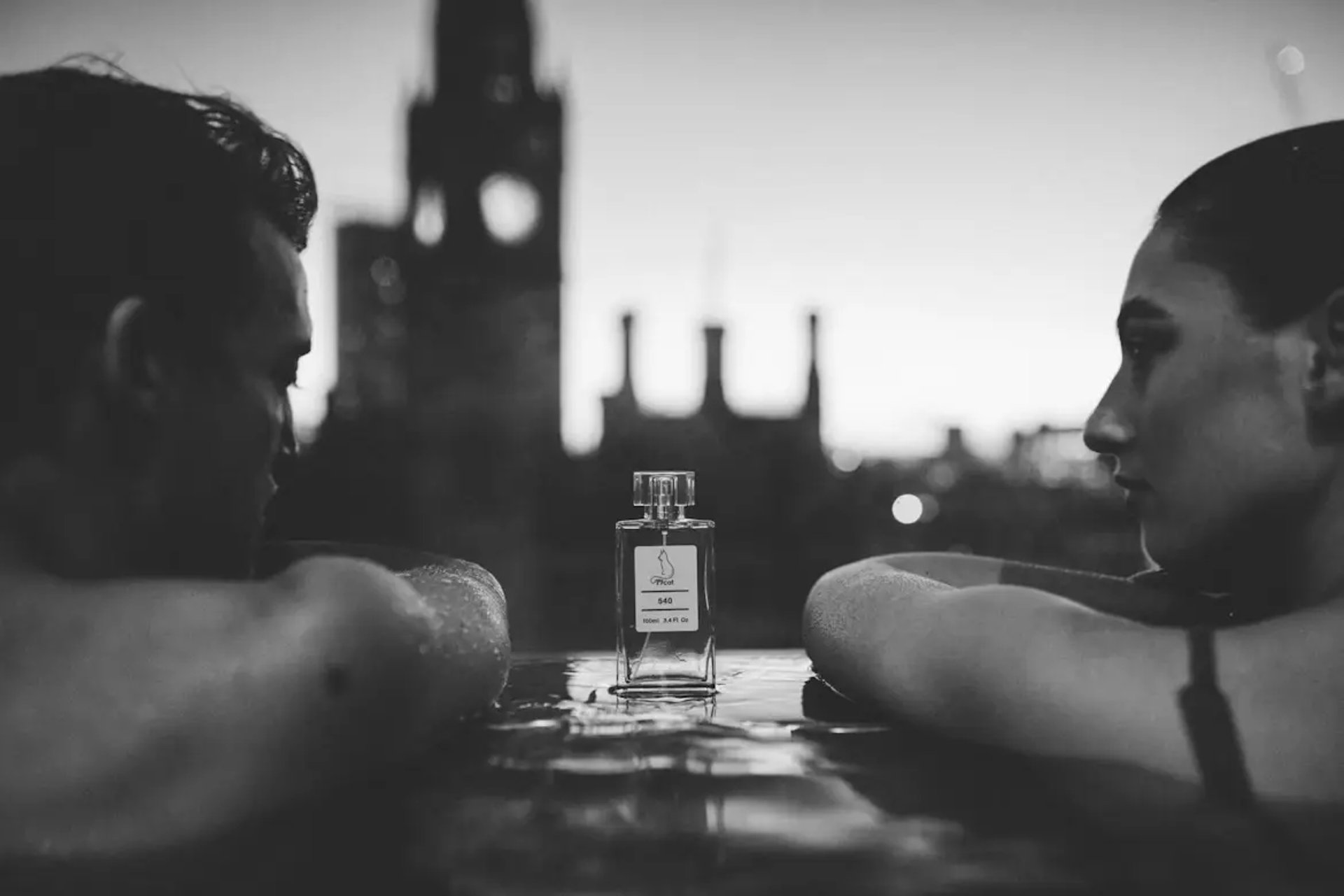 A group of perfume bottles sitting on top of a table