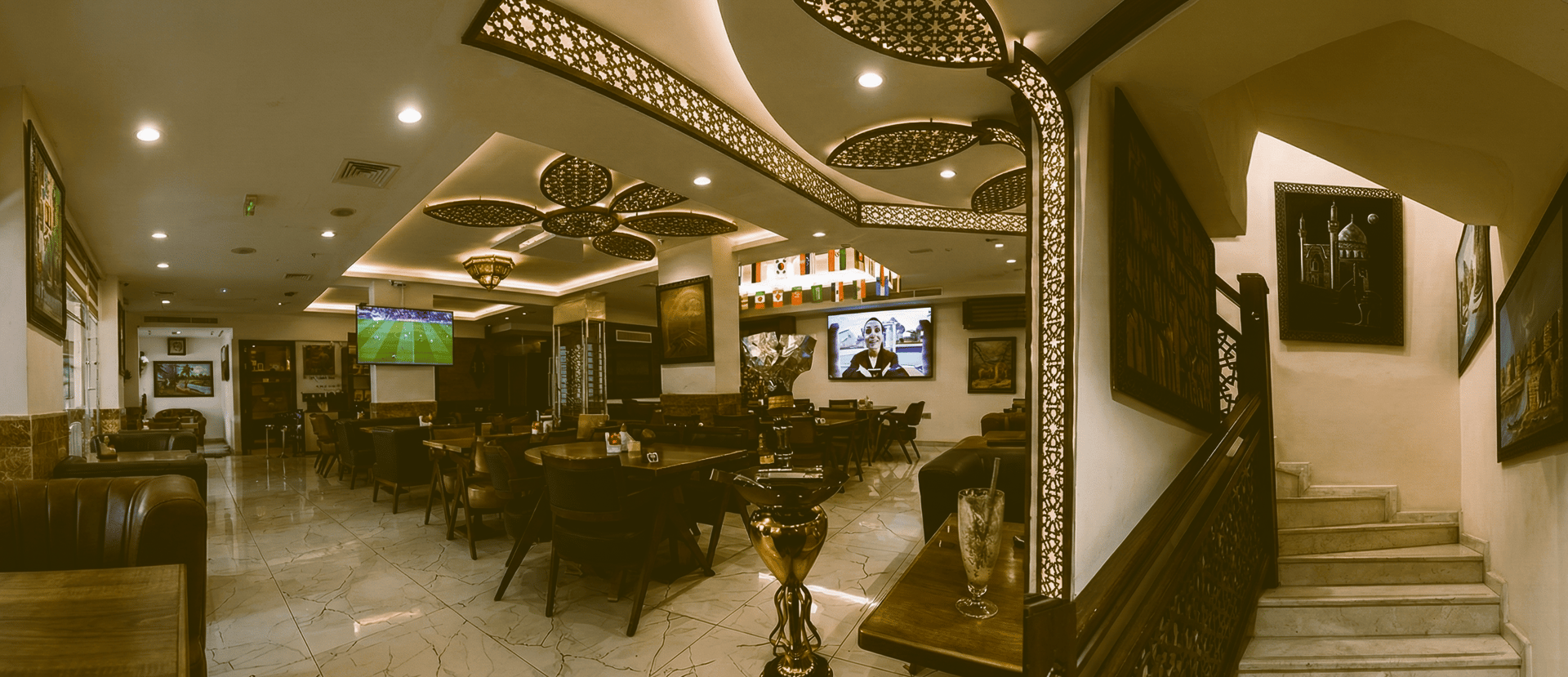 A statue in front of a clock tower